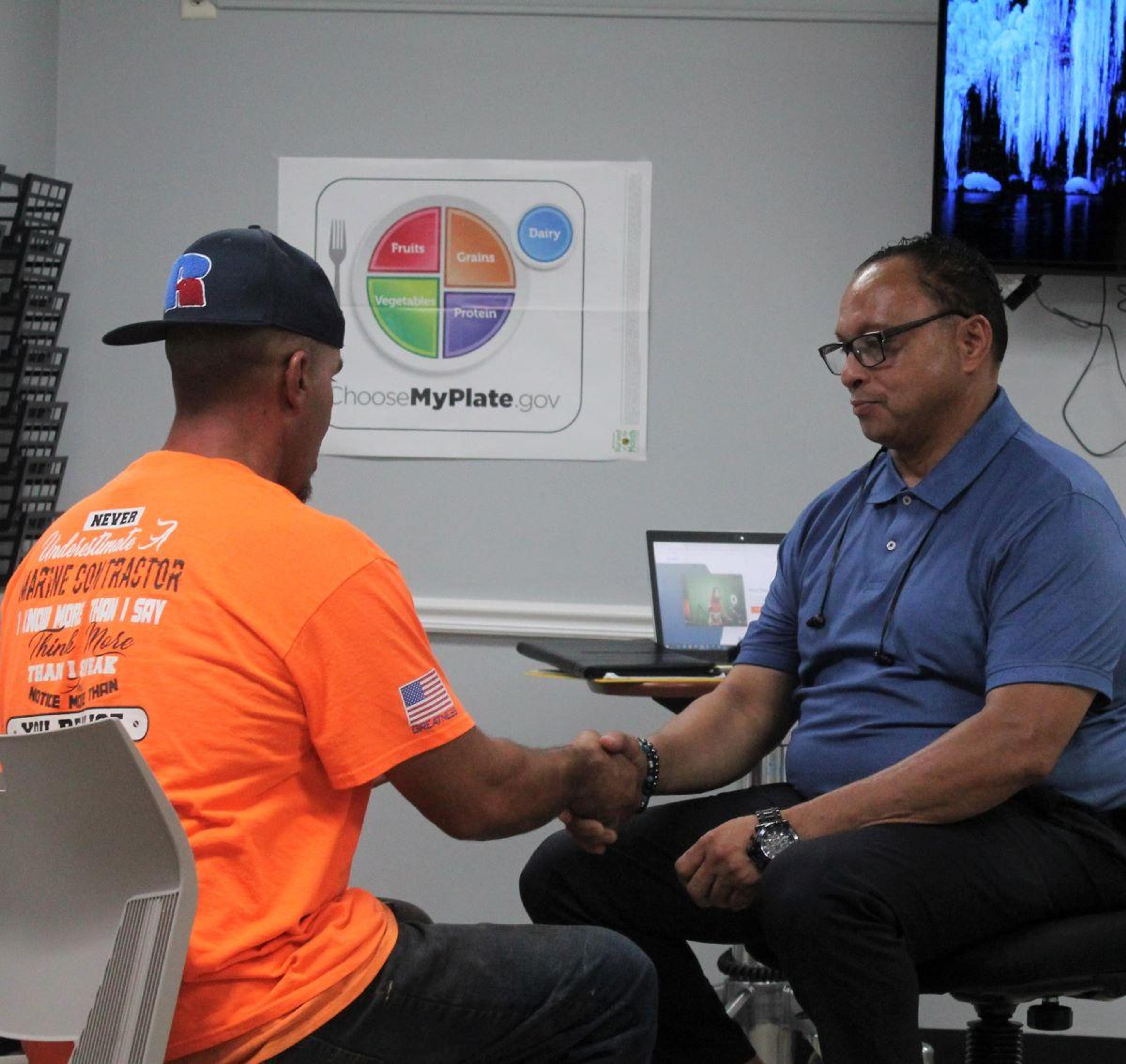 Keith Graham, the Peer Recovery Coach at Popoff Family Health Center, chats with a client during a coaching session.