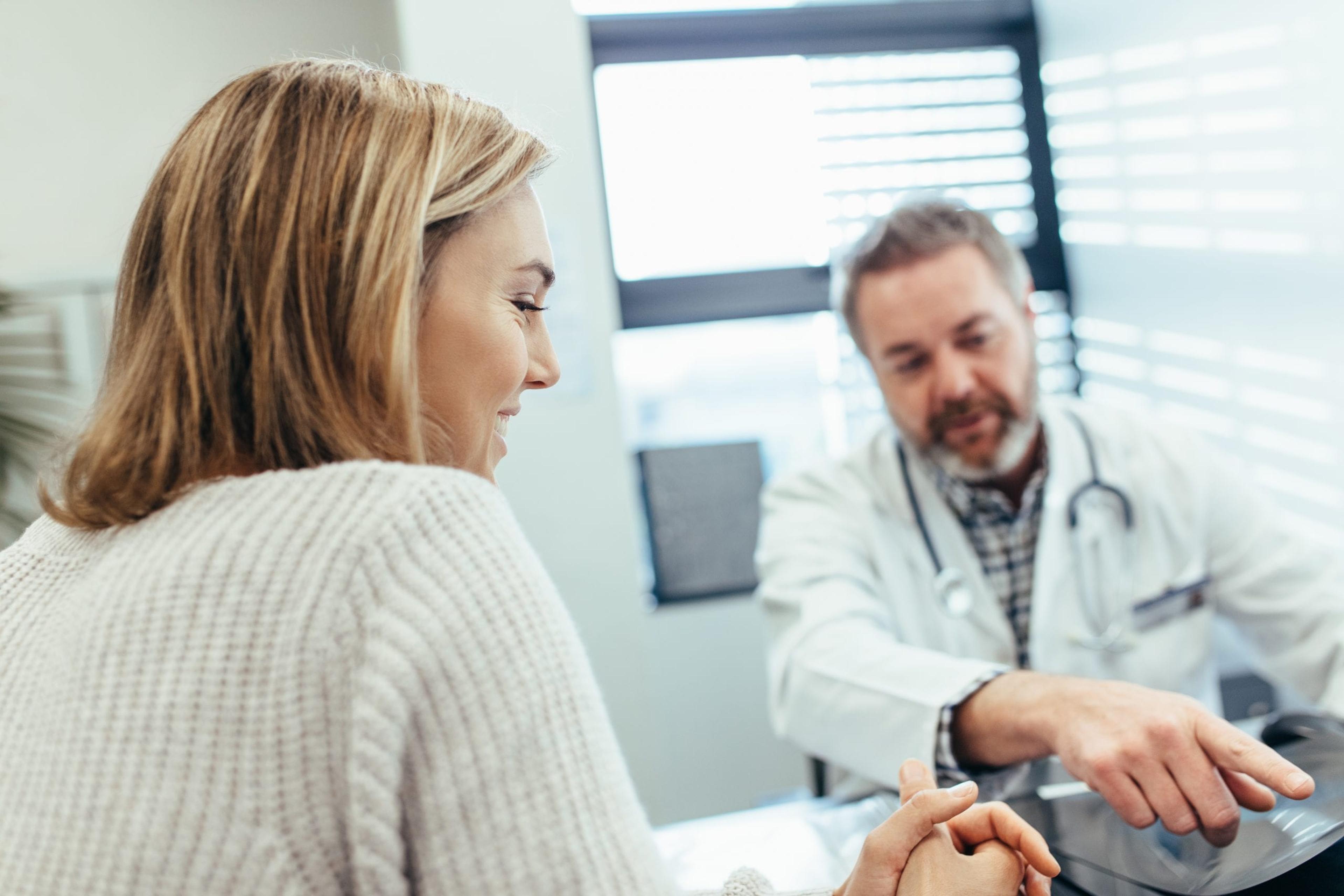 Woman talking with her doctor.