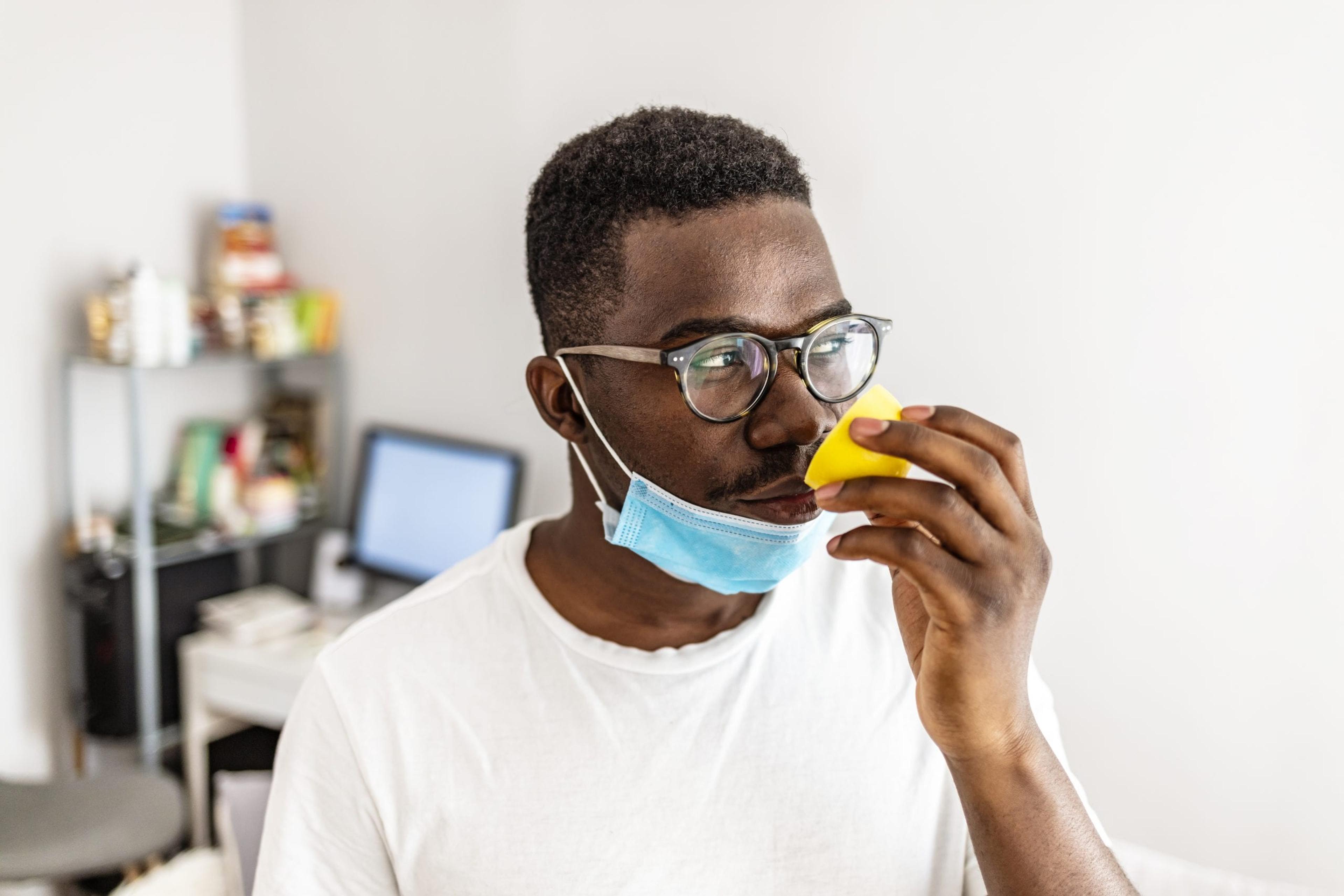 Man smelling a lemon