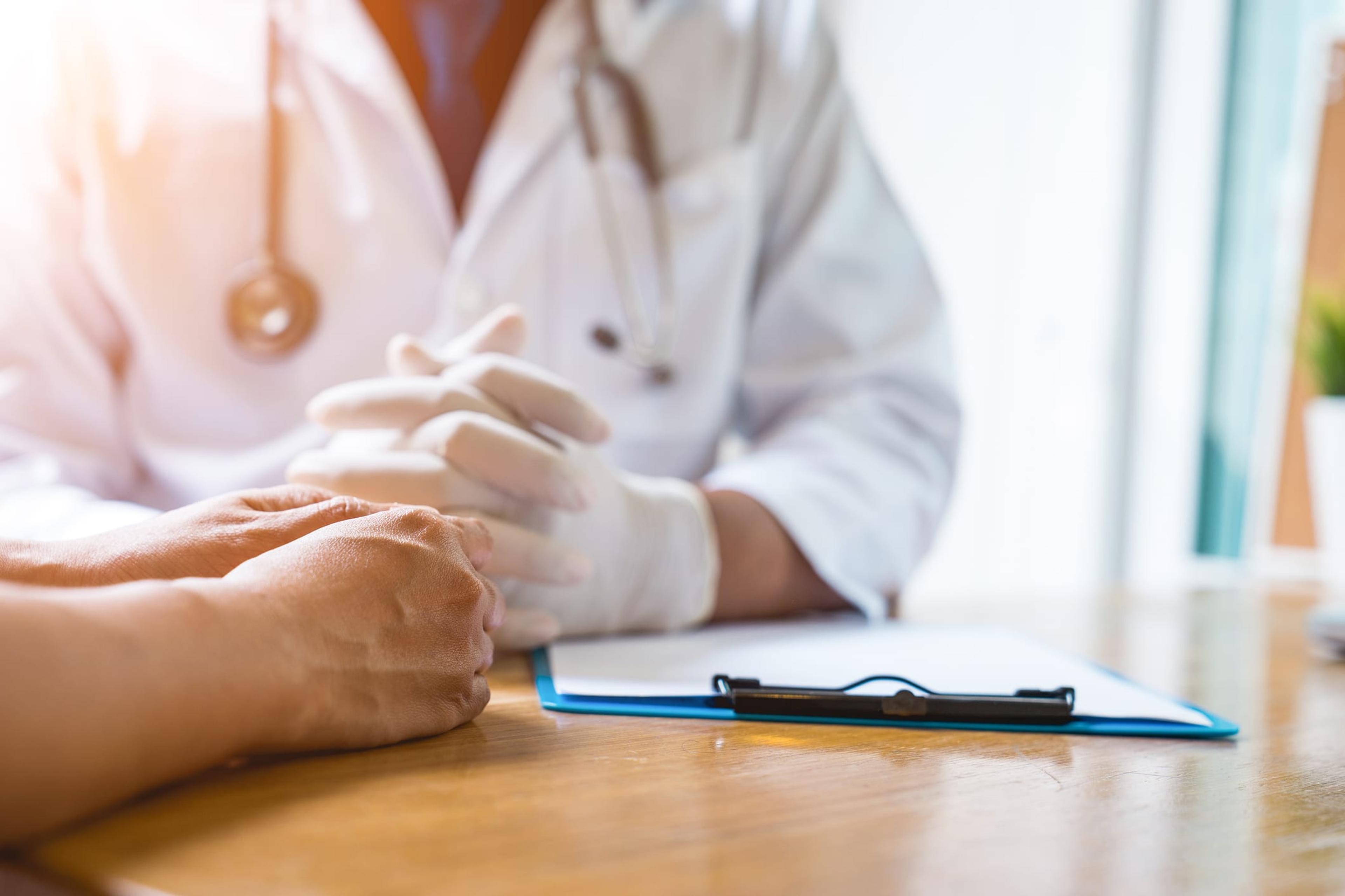 A doctor meets with a patient