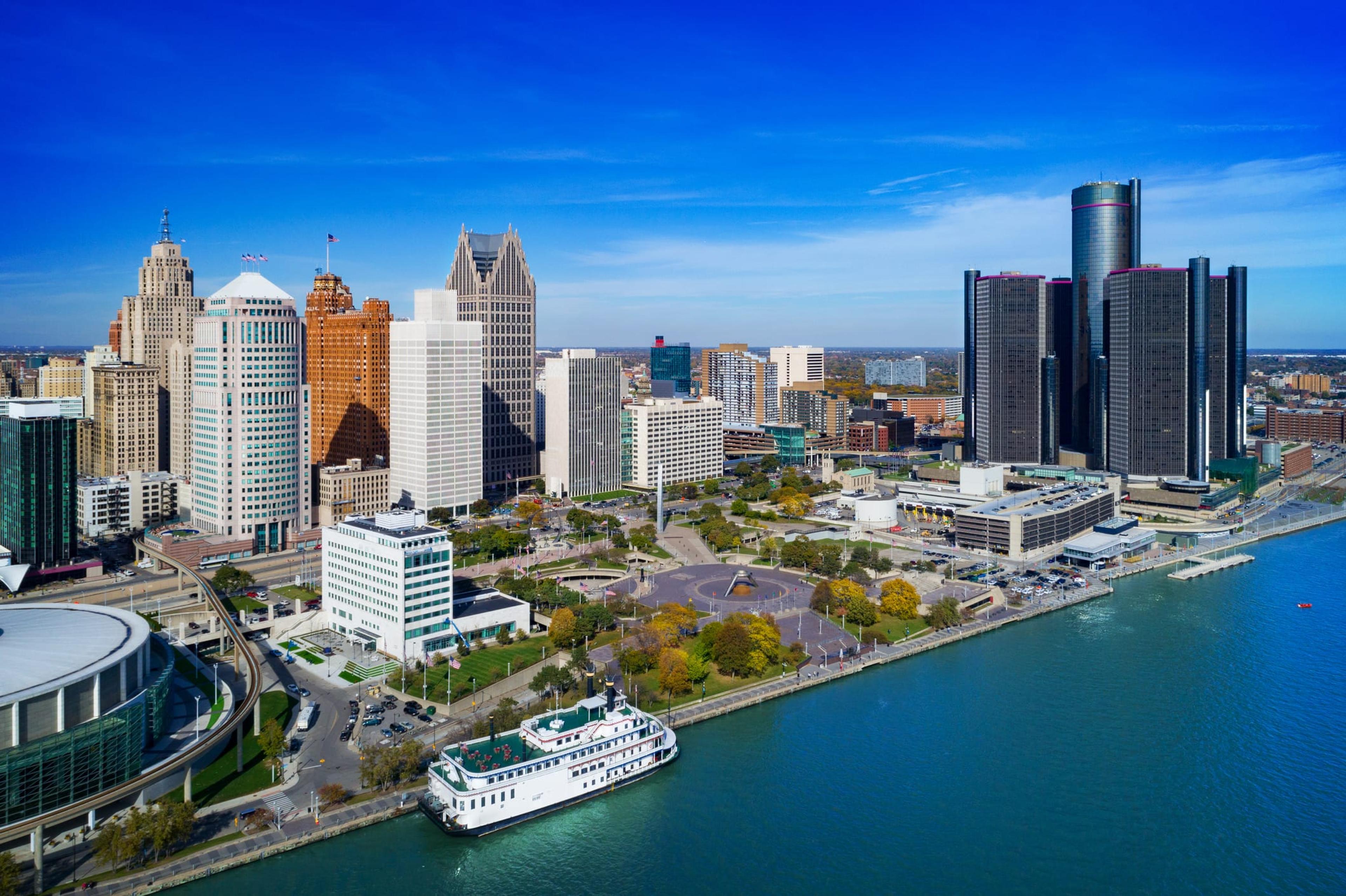 Downtown Detroit Aerial Skyline View With Ferry Boat And River