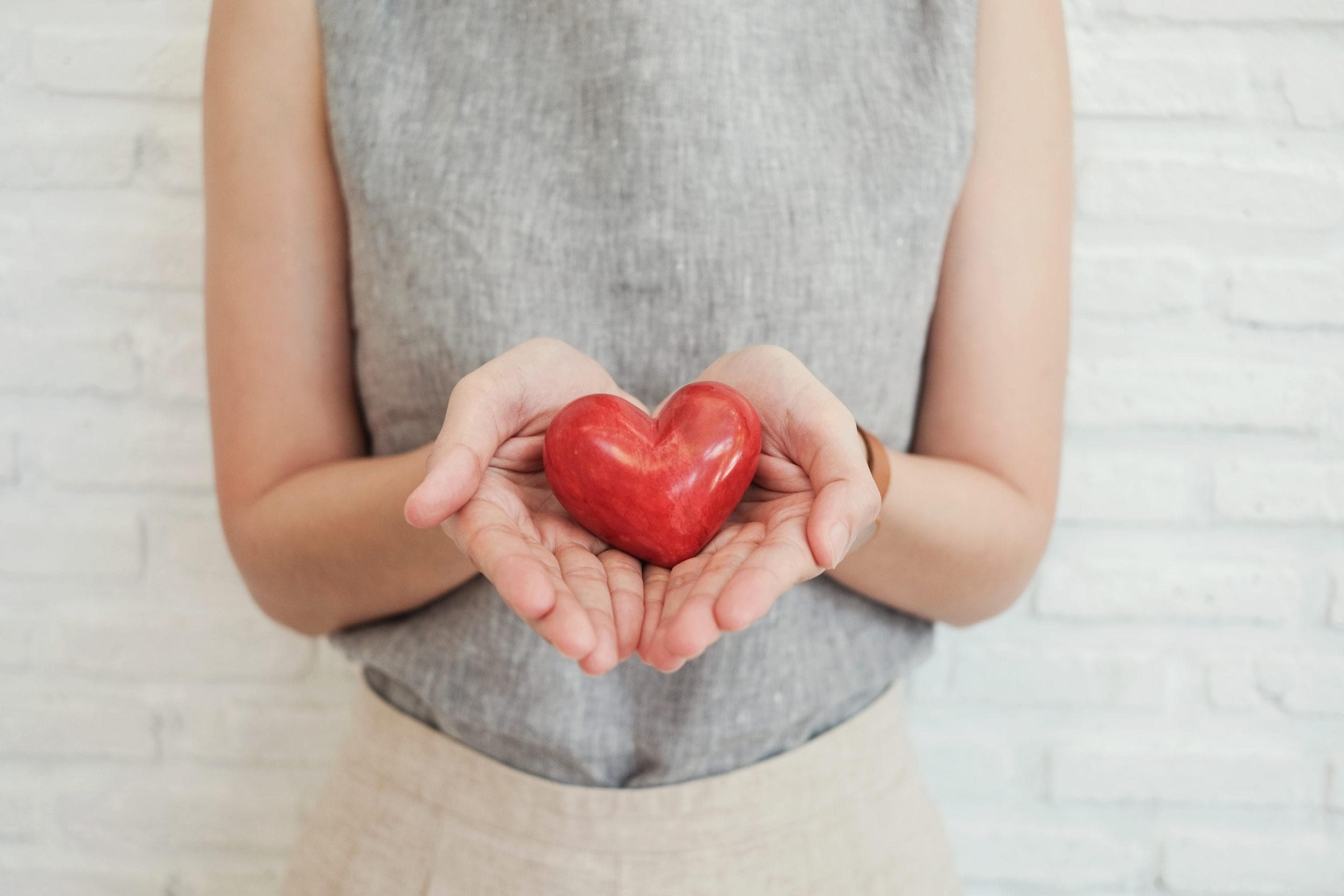 Woman holding a red heart