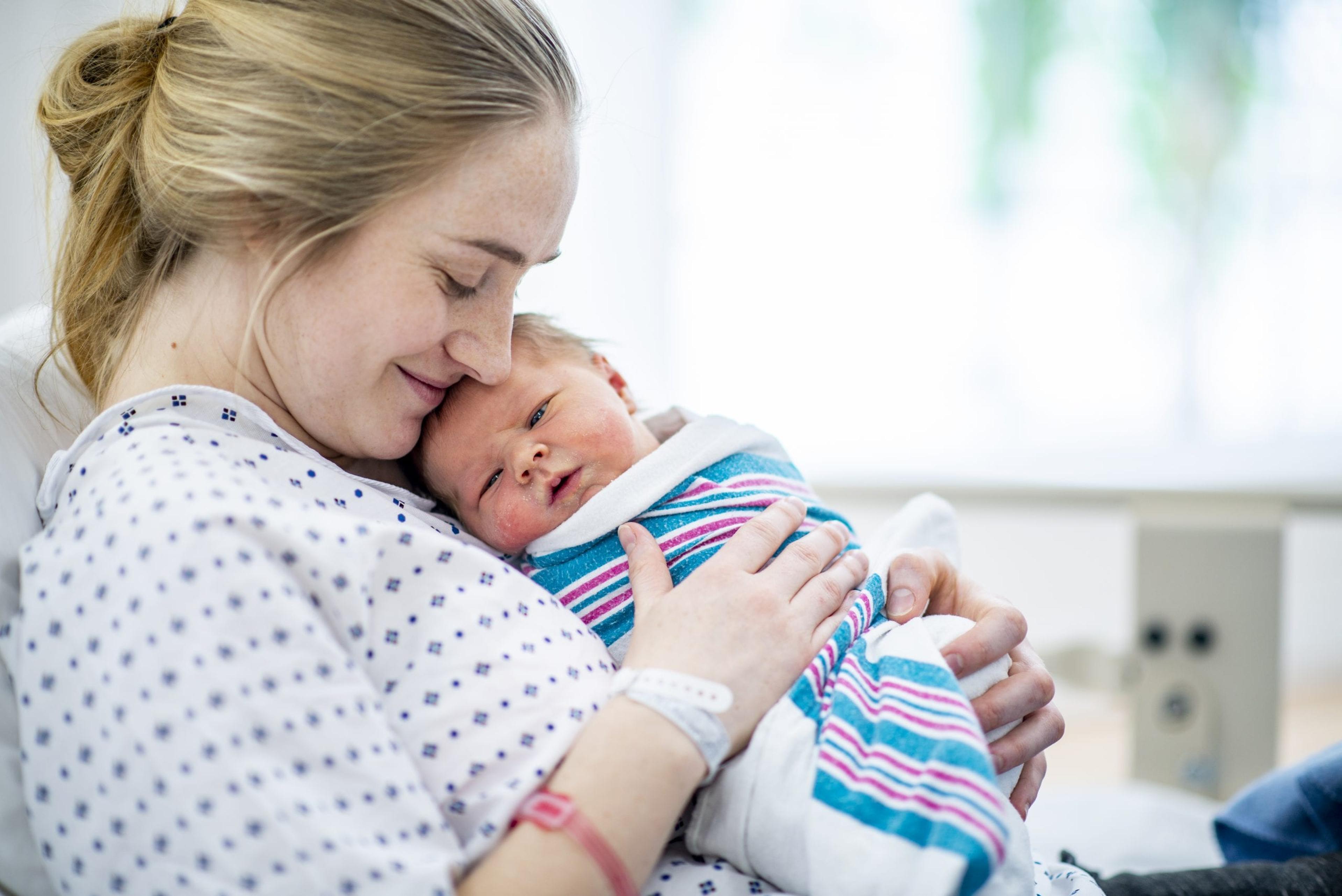 Mom holding newborn