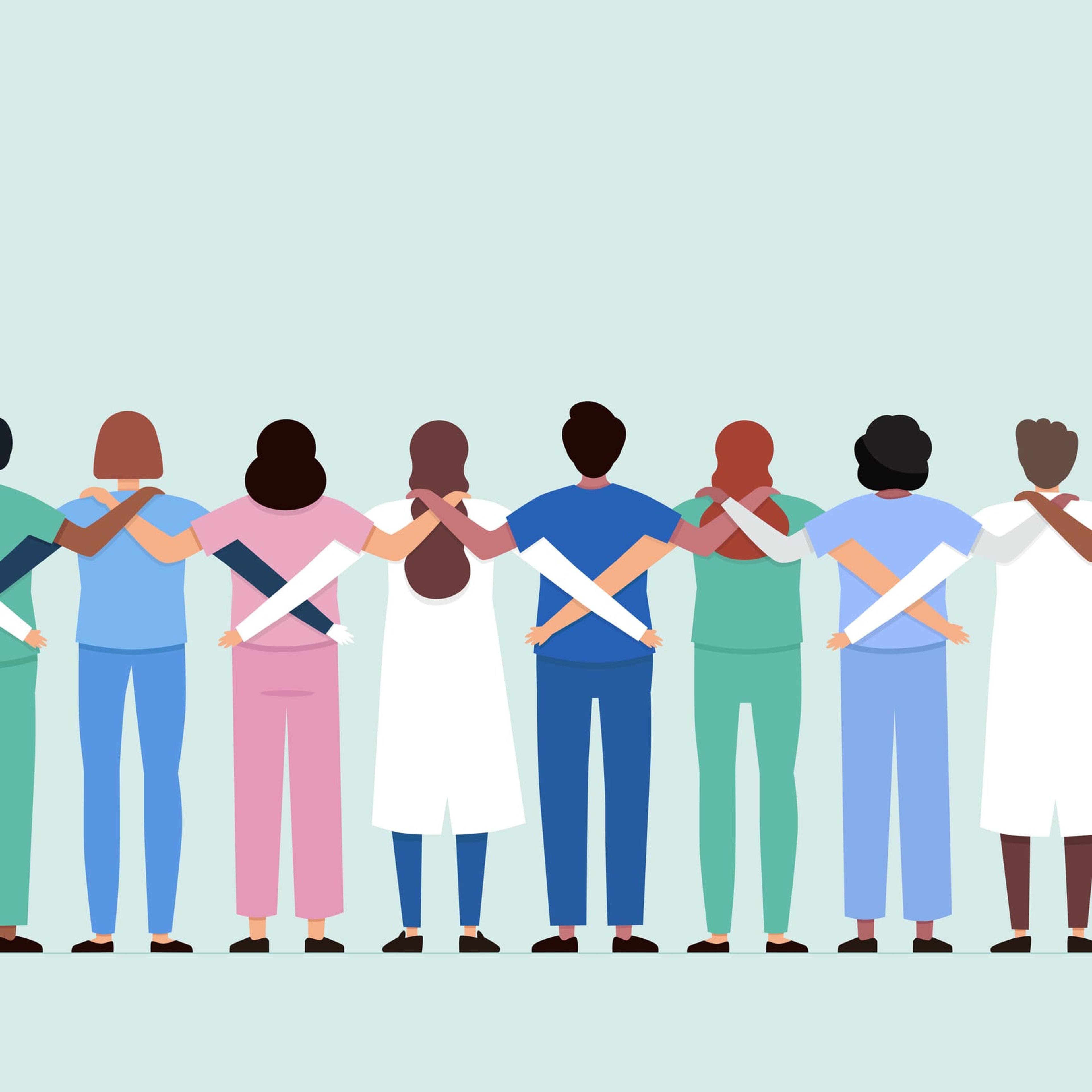 health care workers holding each other