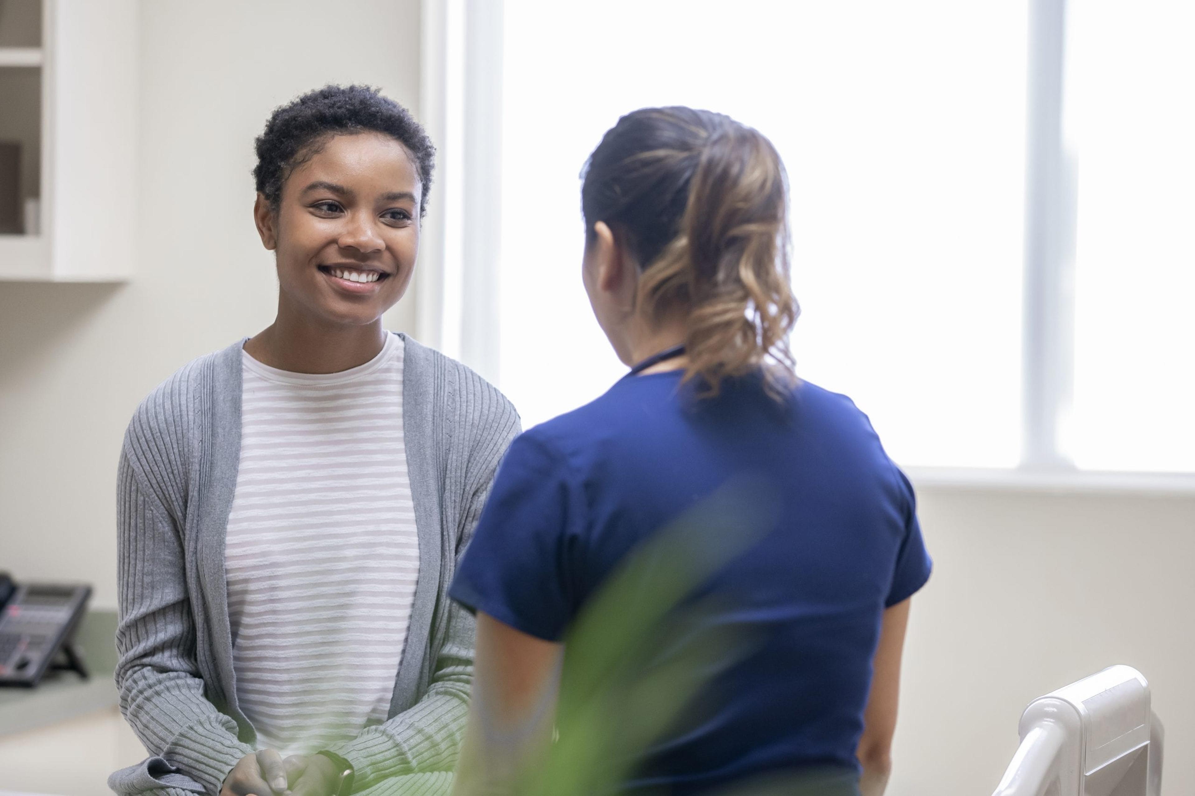 Female patient talking to a nurse