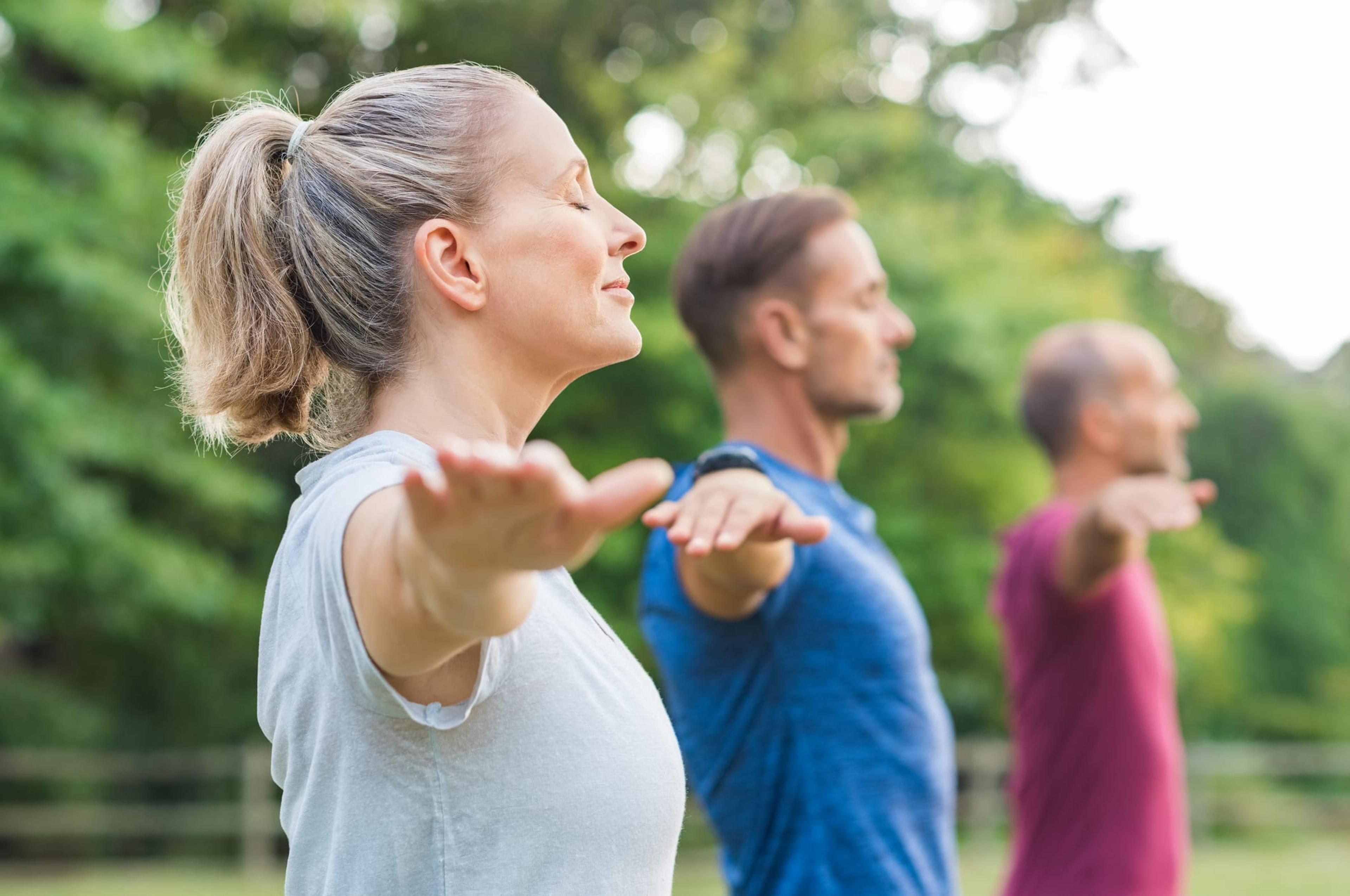 Group of people doing yoga.