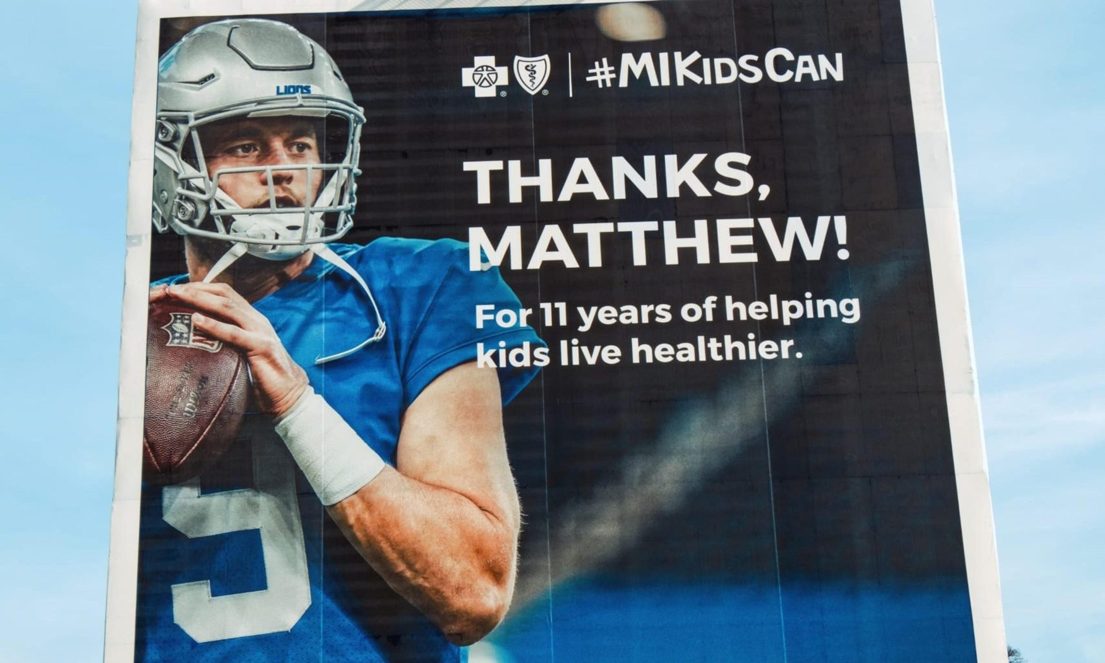 Outdoor billboard that displays a photo of Matthew Stafford with text saying thank you.
