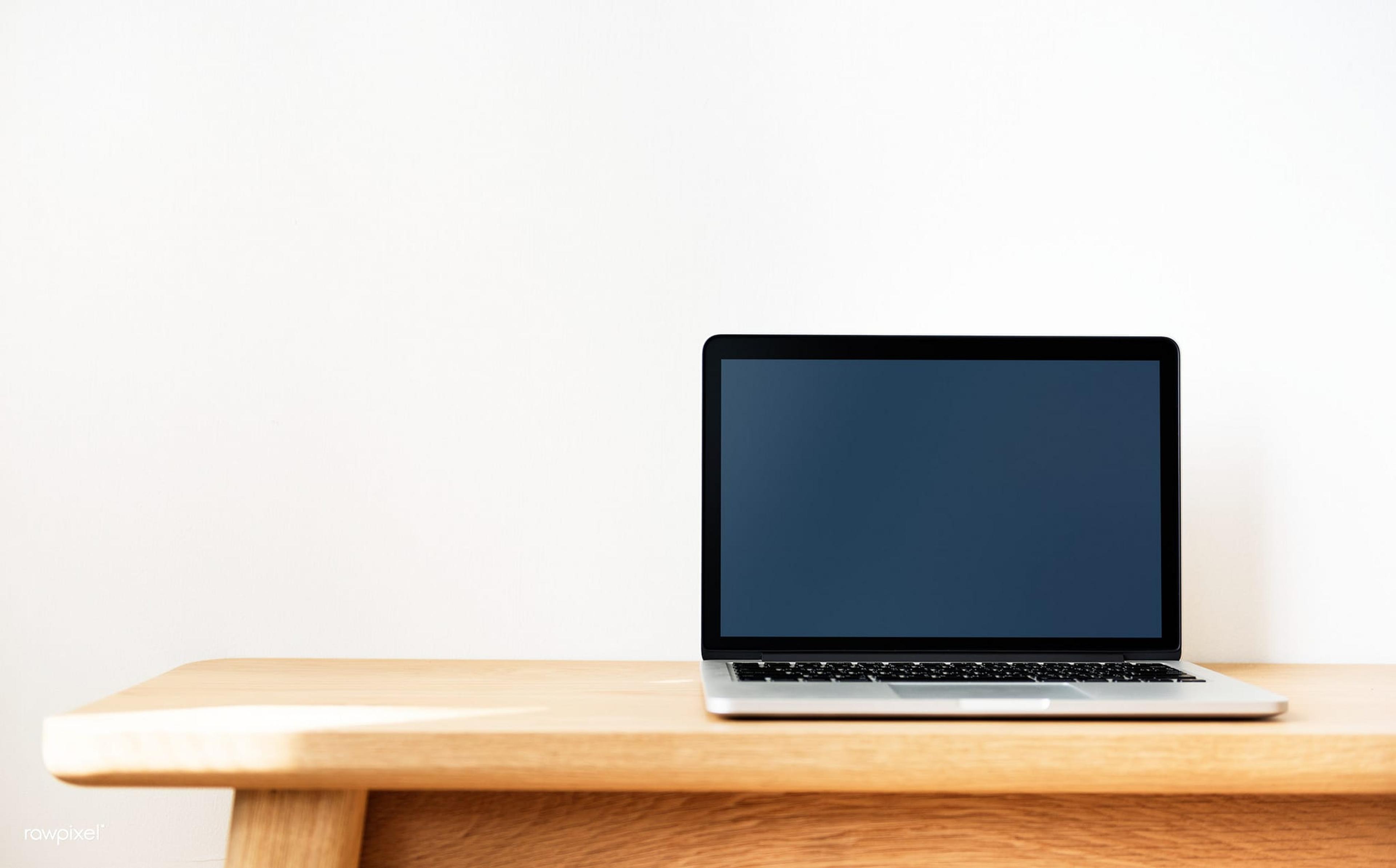 image of a laptop on a wooden table