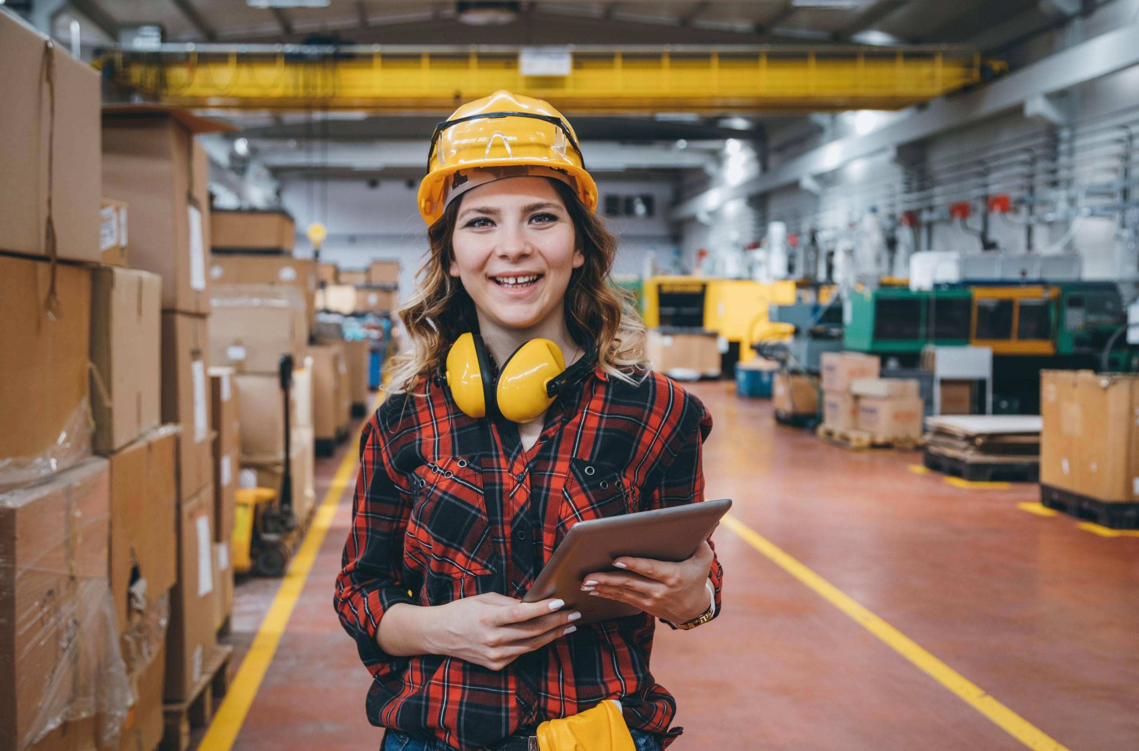 Female manufacturing worker smiling