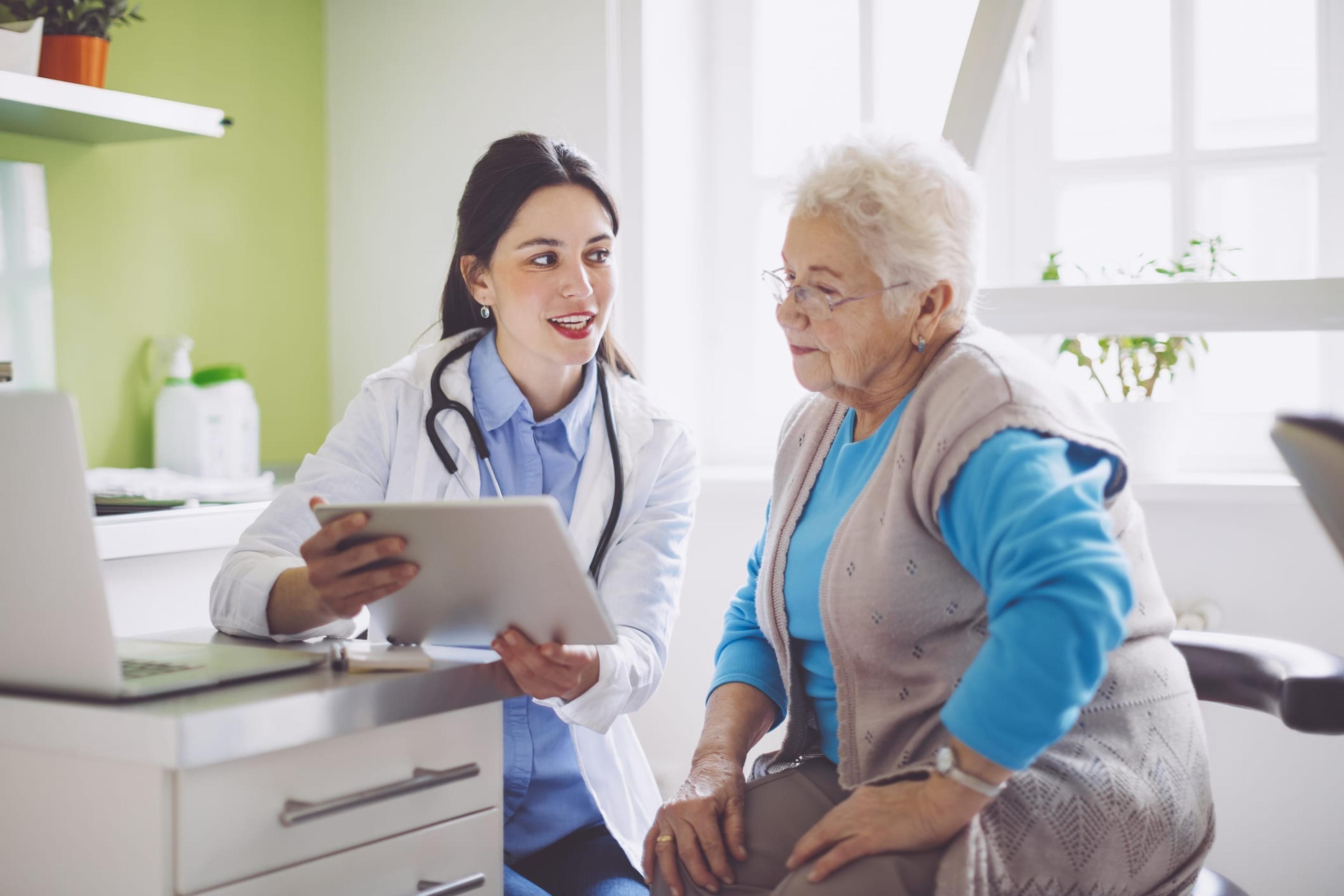 Doctor consulting her older female patient