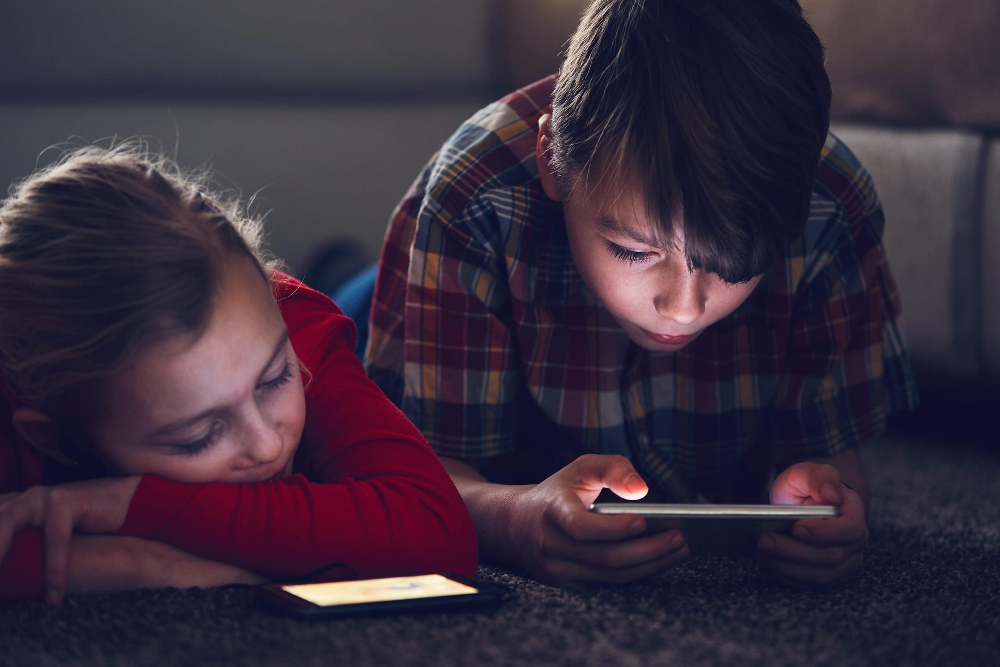 Girl and boy with their smart phones