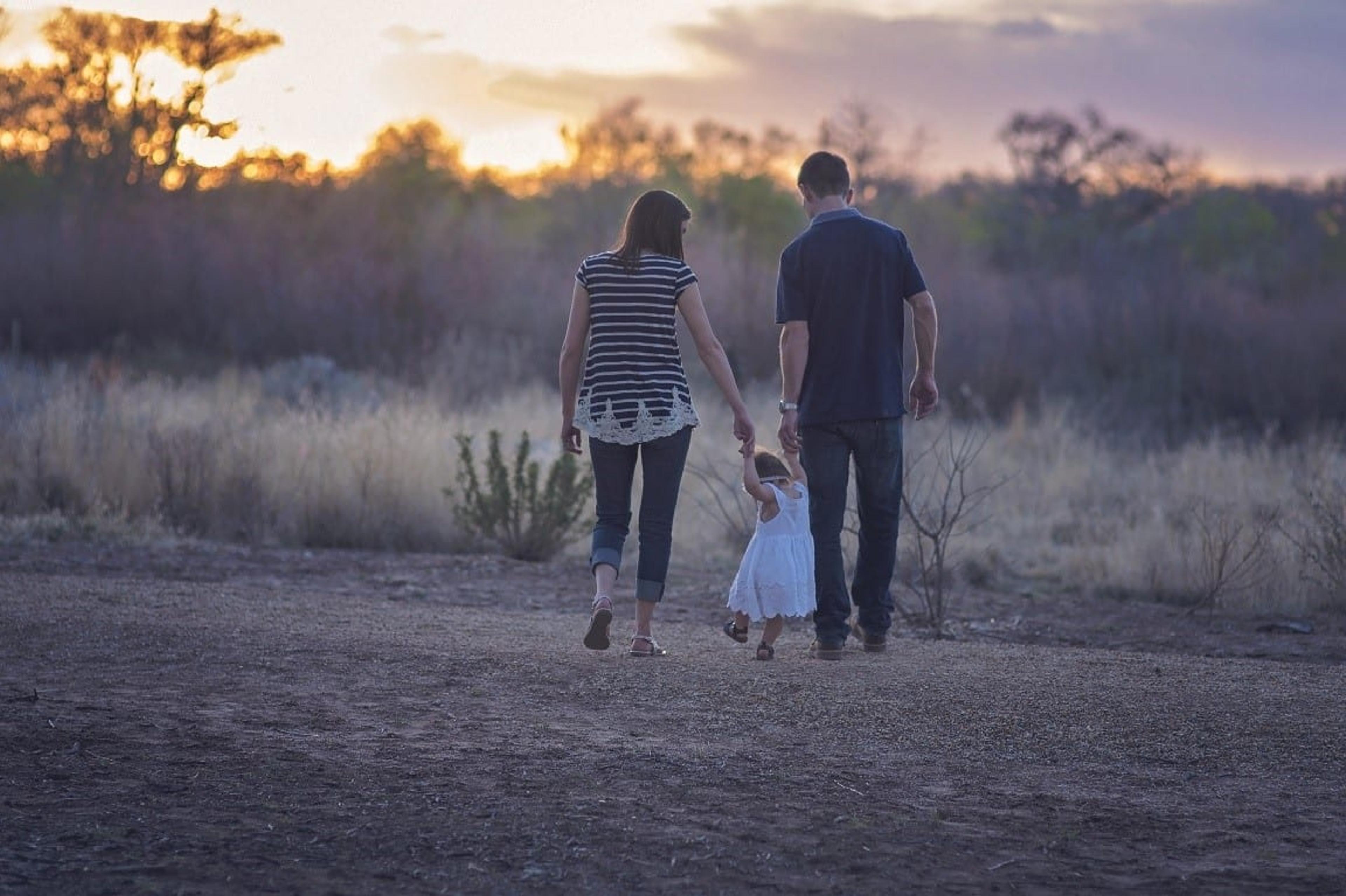 Family of all ages walks and discusses specialty insurance