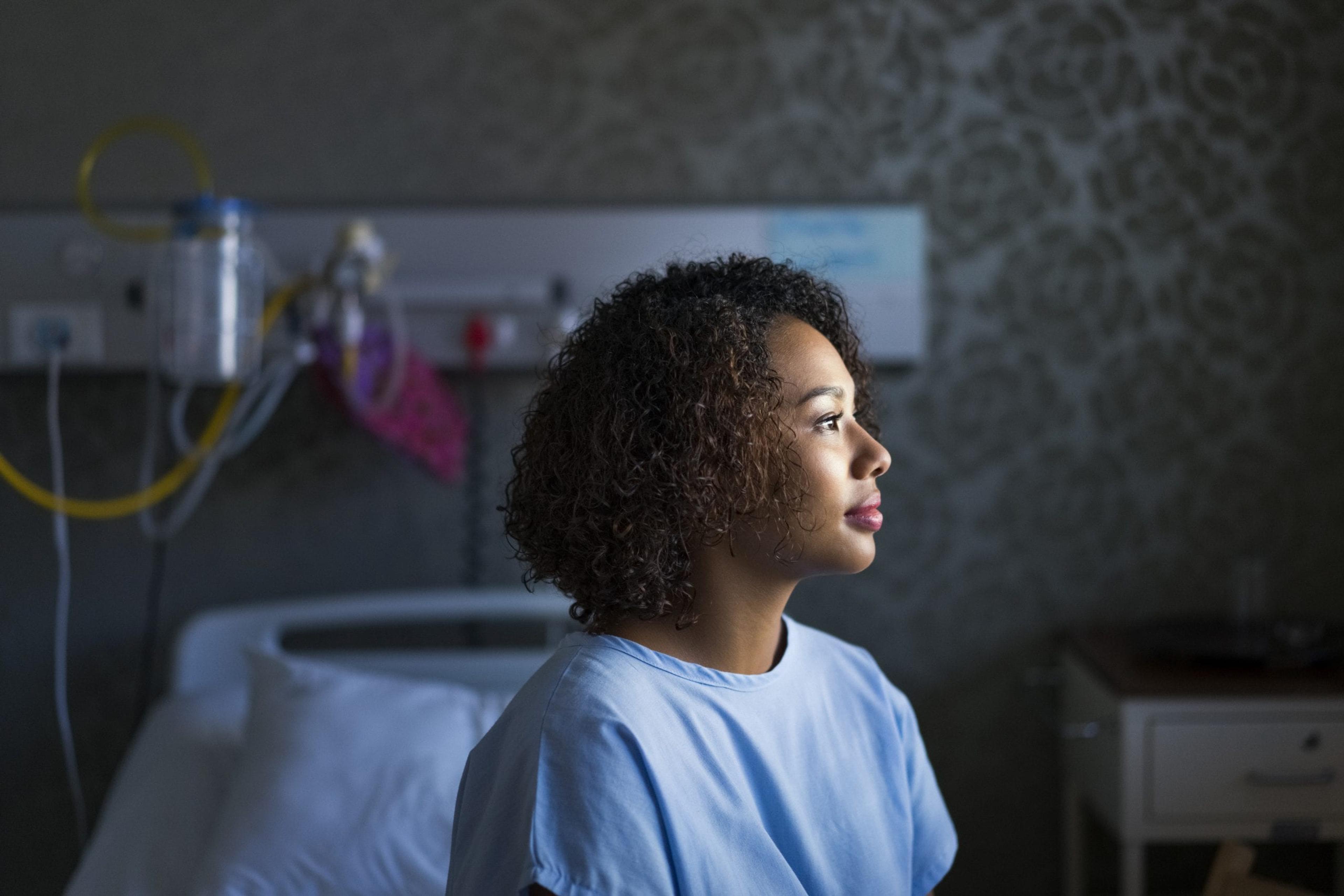 Female patient in a hospital room.