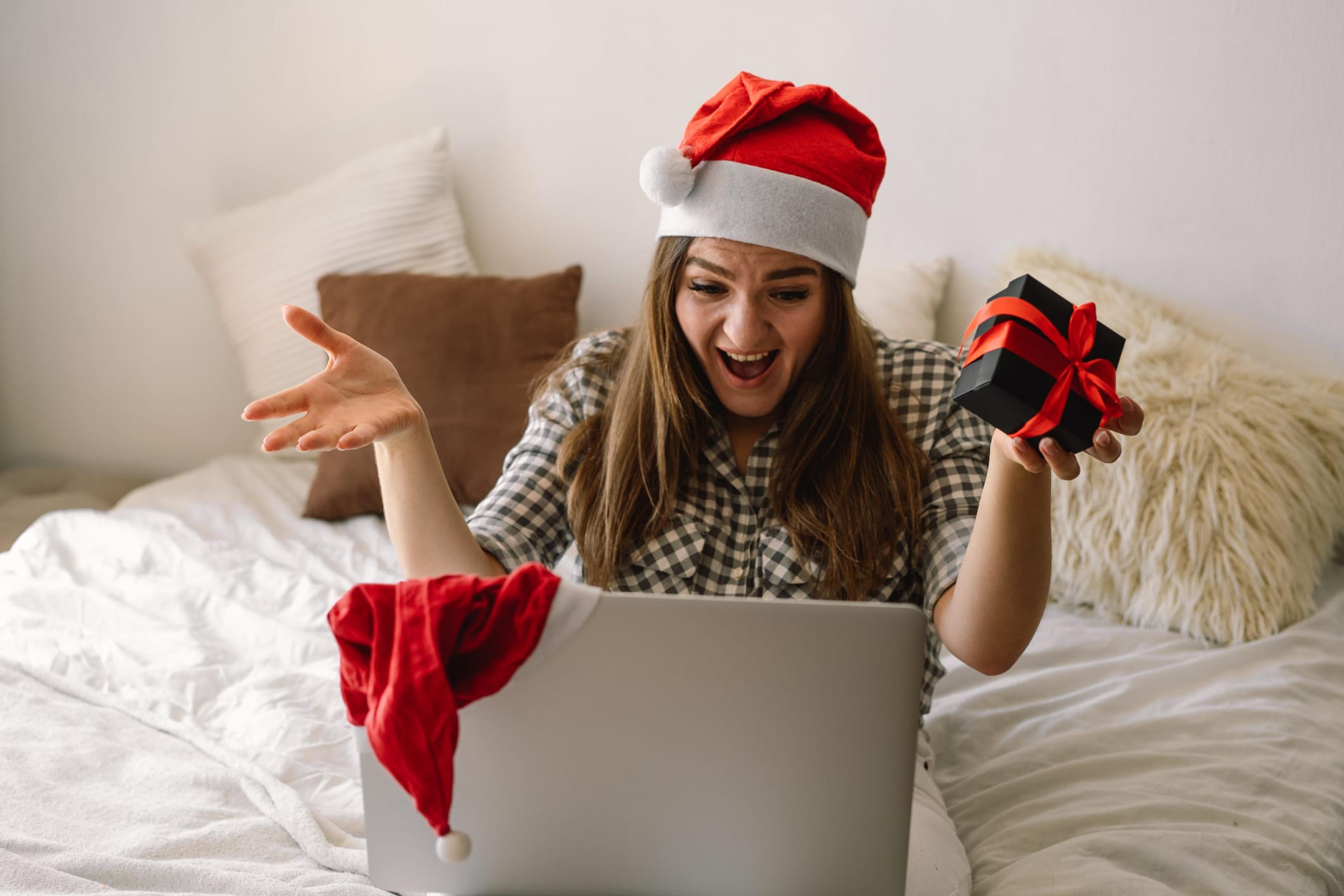 Woman enjoying a work holiday party on video conference