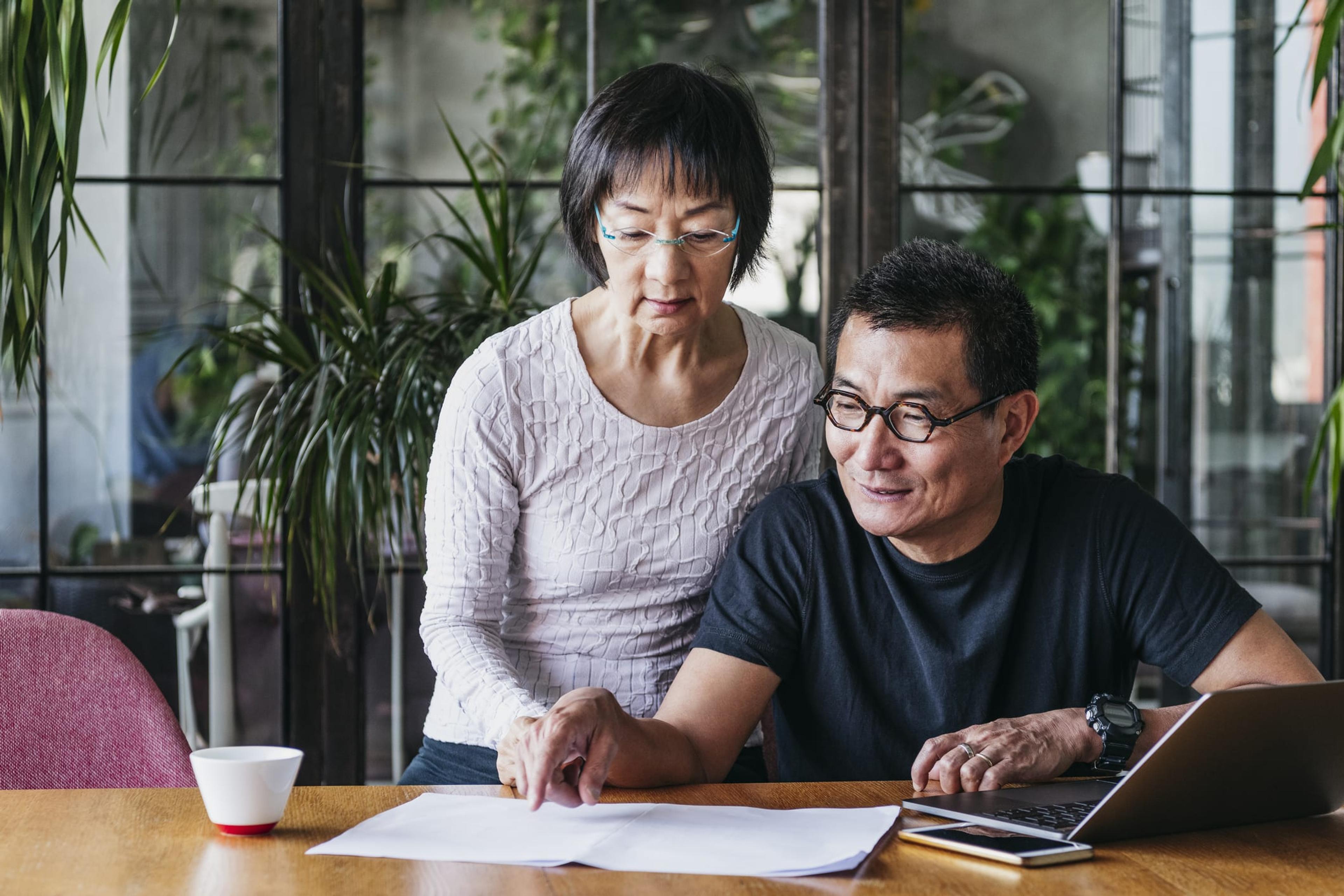 Happy couple selecting health insurance