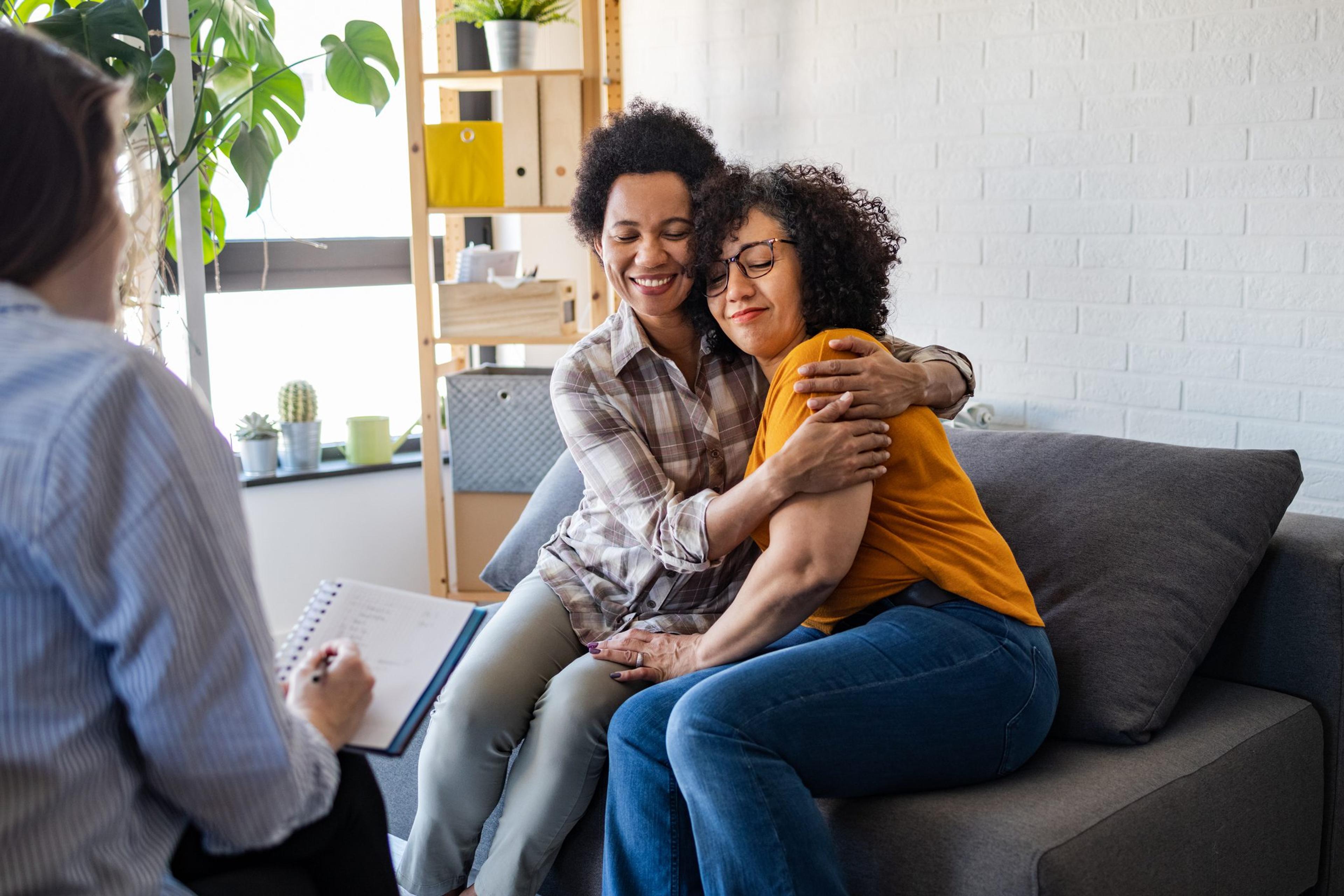 Lesbian couple getting relationship counseling by therapist