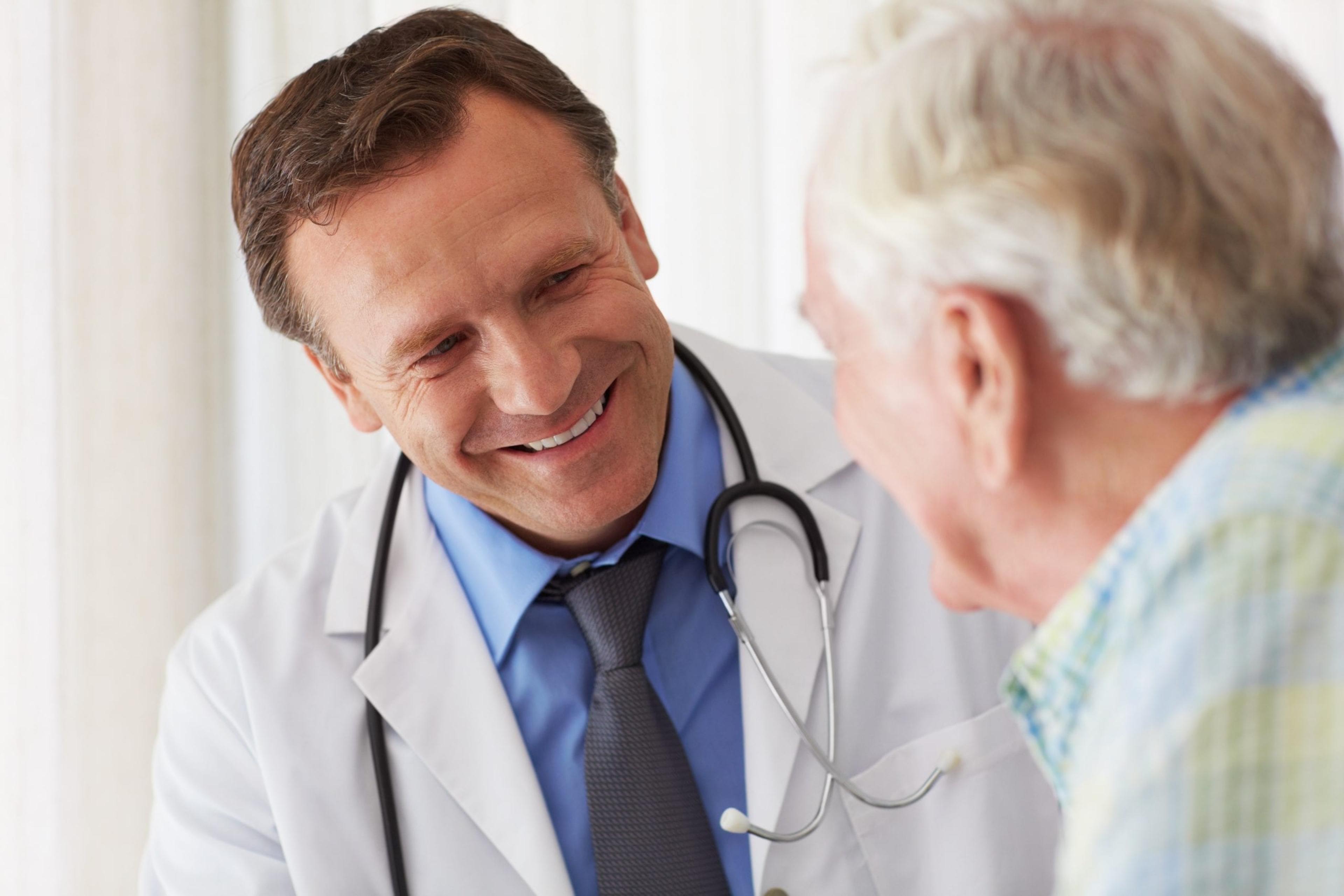 Doctor talking to older patient.