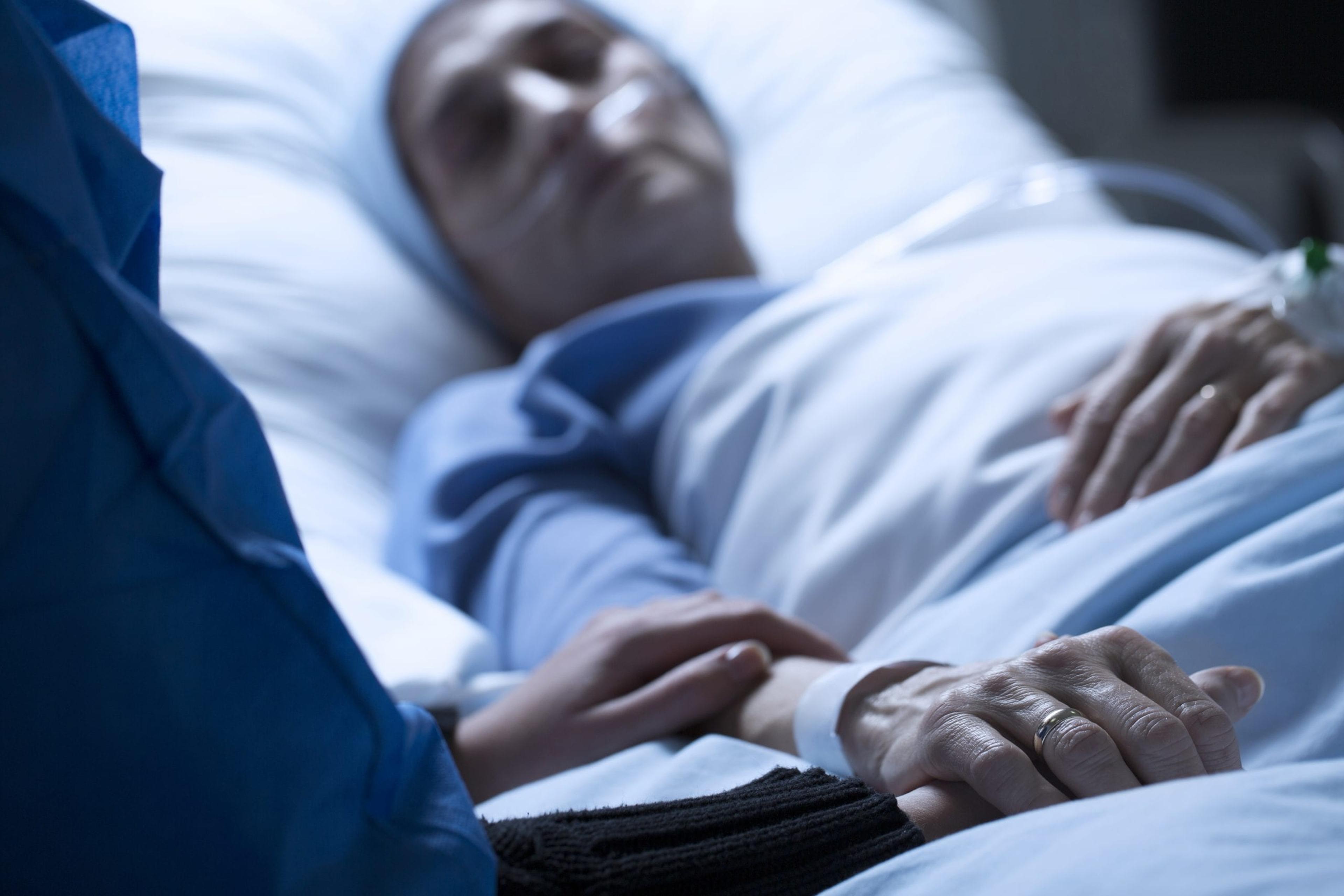 Elderly patient in hospital bed