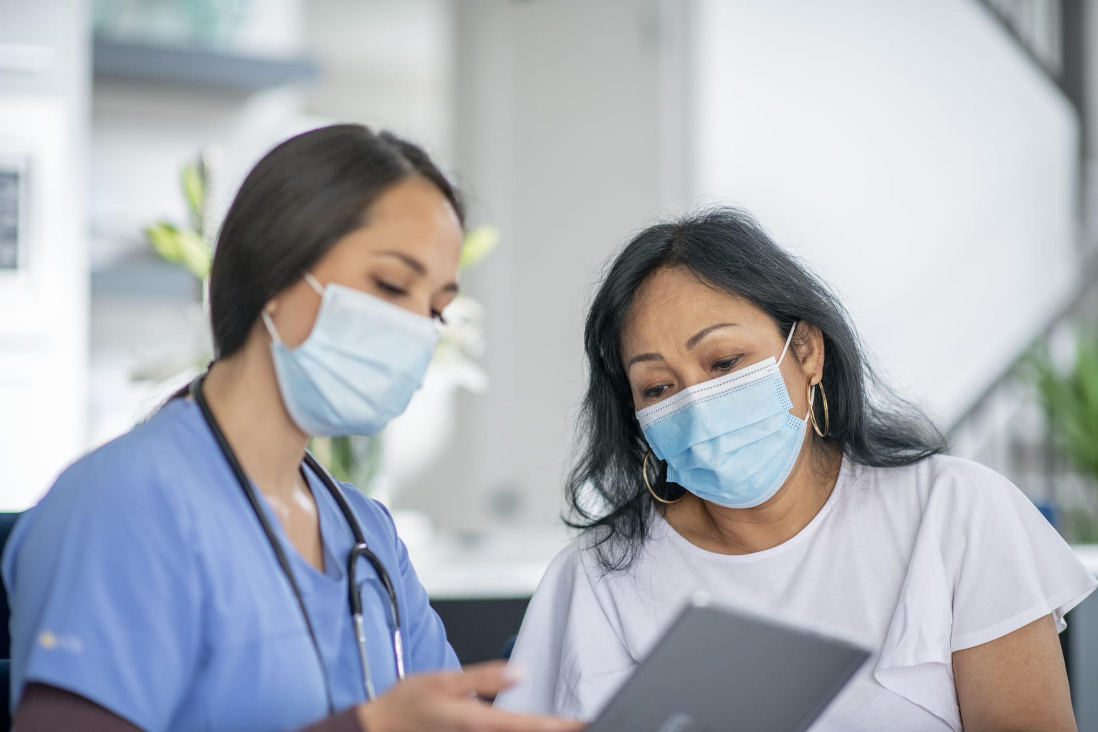 Nurse and patient wearing masks