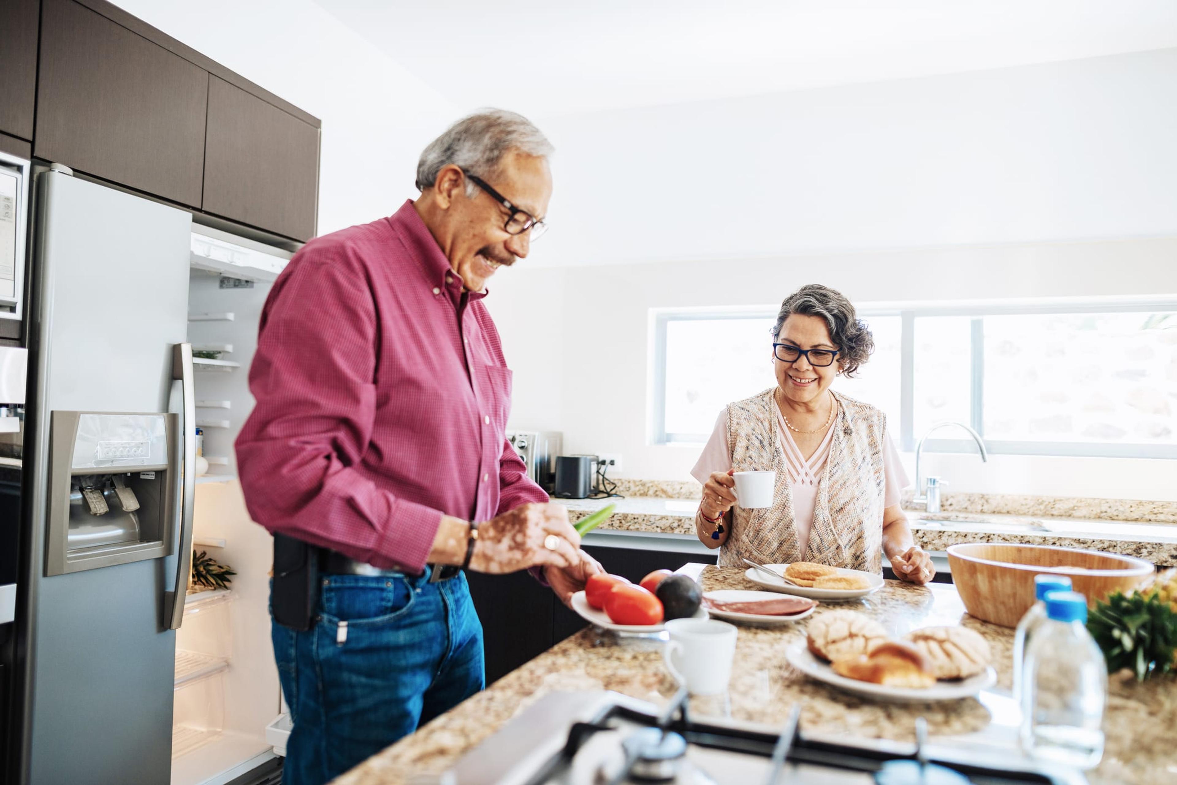 Senior couple makes nutritious lunch to prevent colon cancer