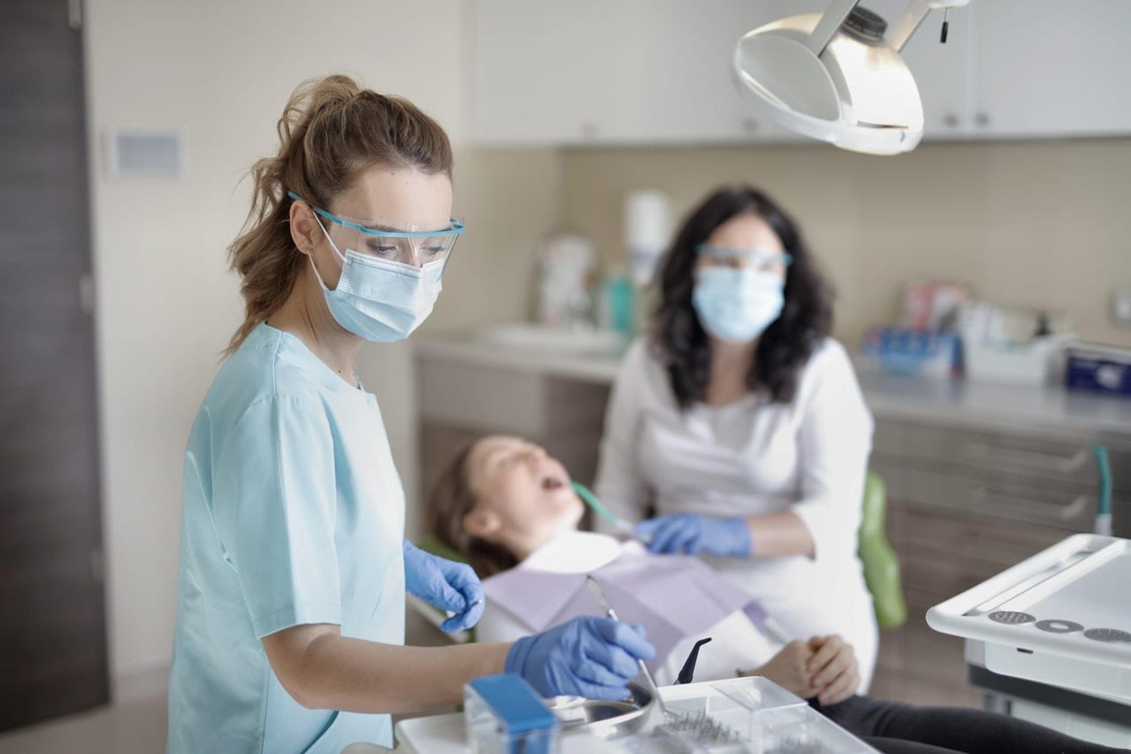 Dentist cleaning teeth