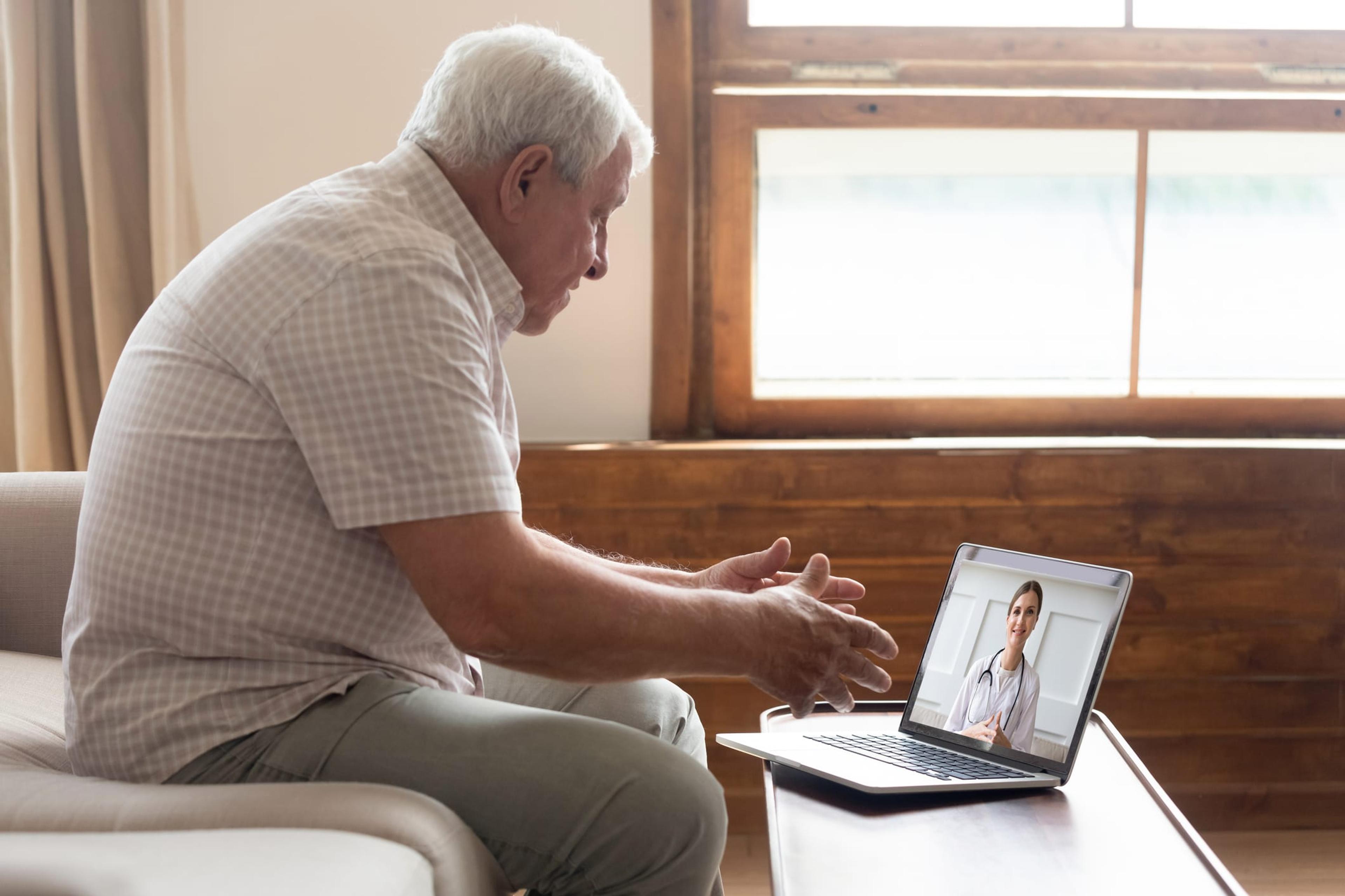 Older man does a doctor's visit through a video call
