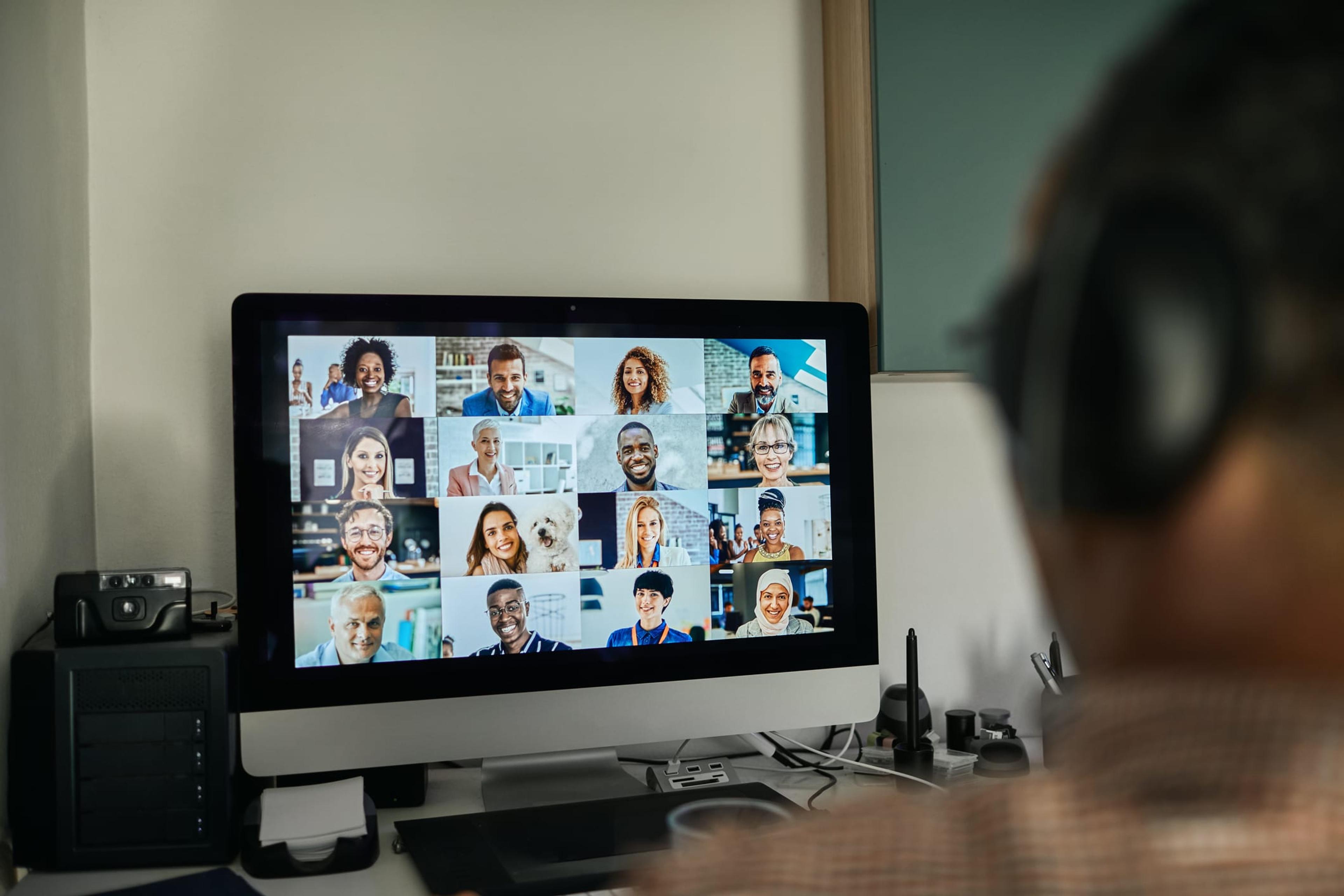 Man meeting with his team on webcam