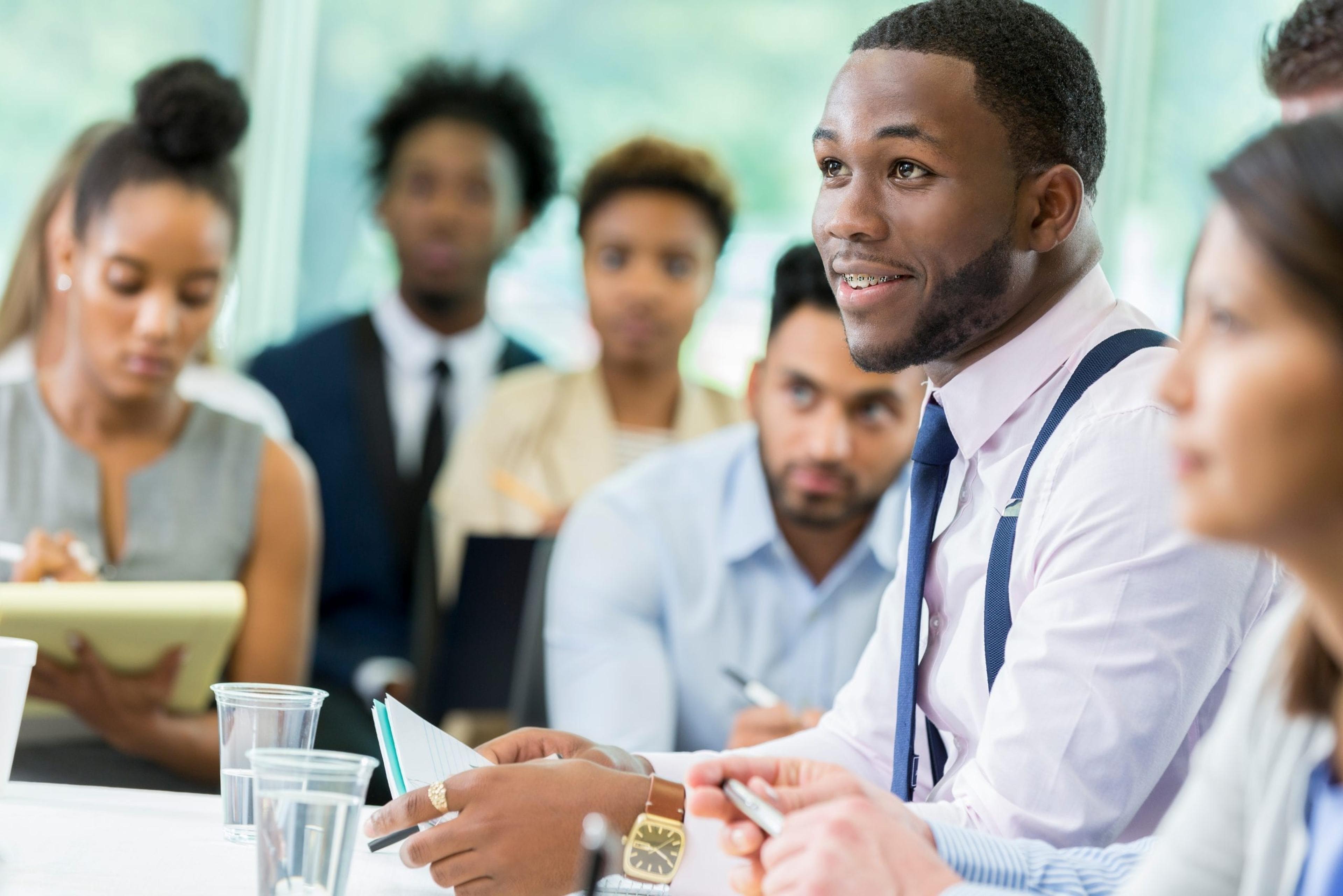 Young man speaking at a business meeting