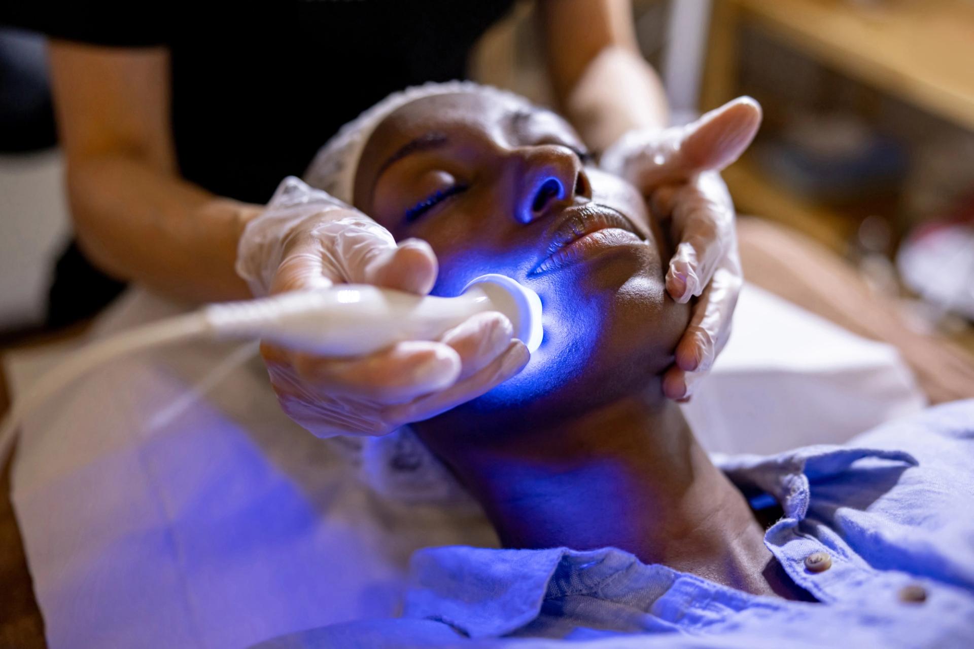 Esthetician providing a modern skincare treatment
