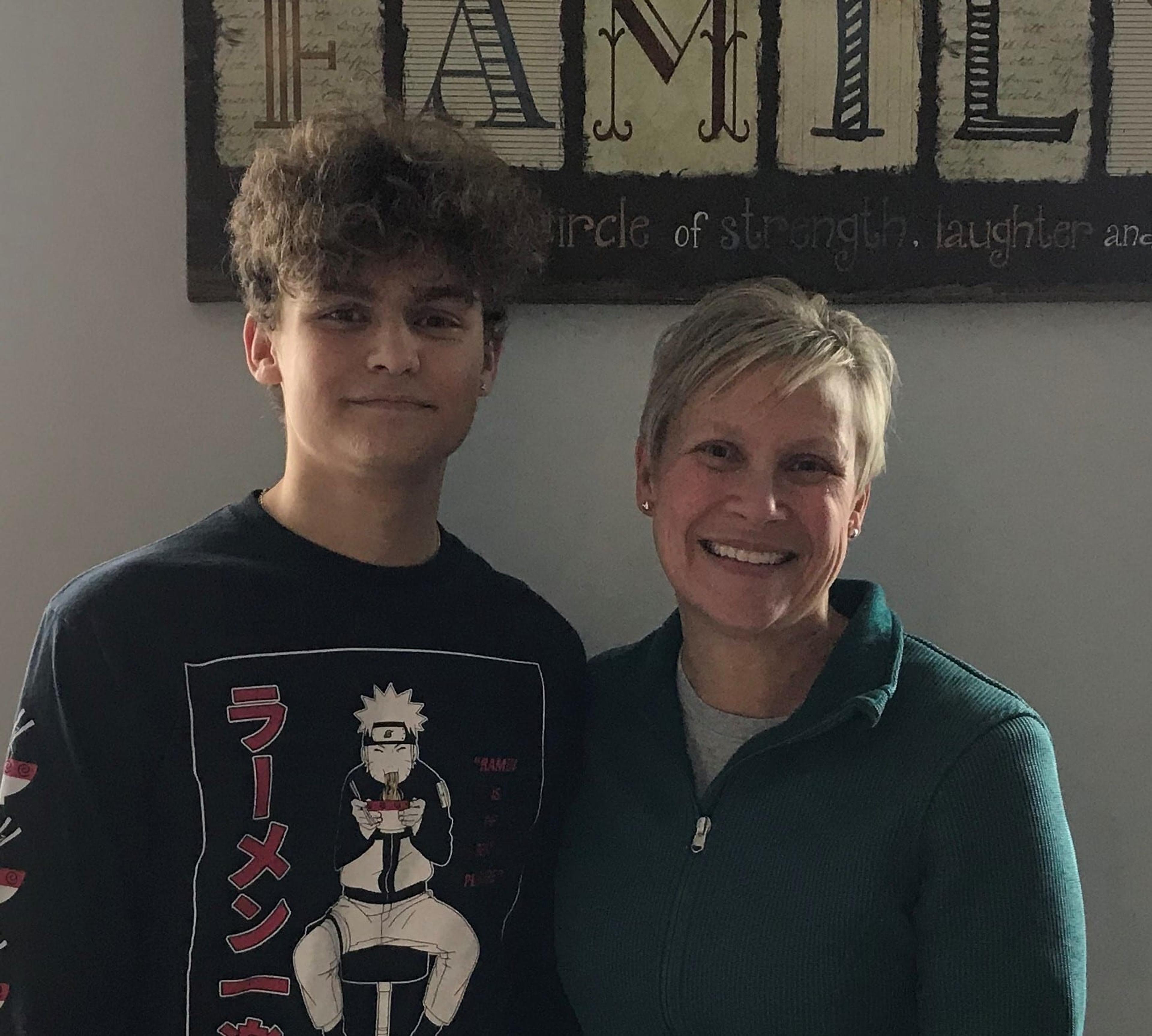 Jack Farkas poses for a photo with his mom, Julie Farkas