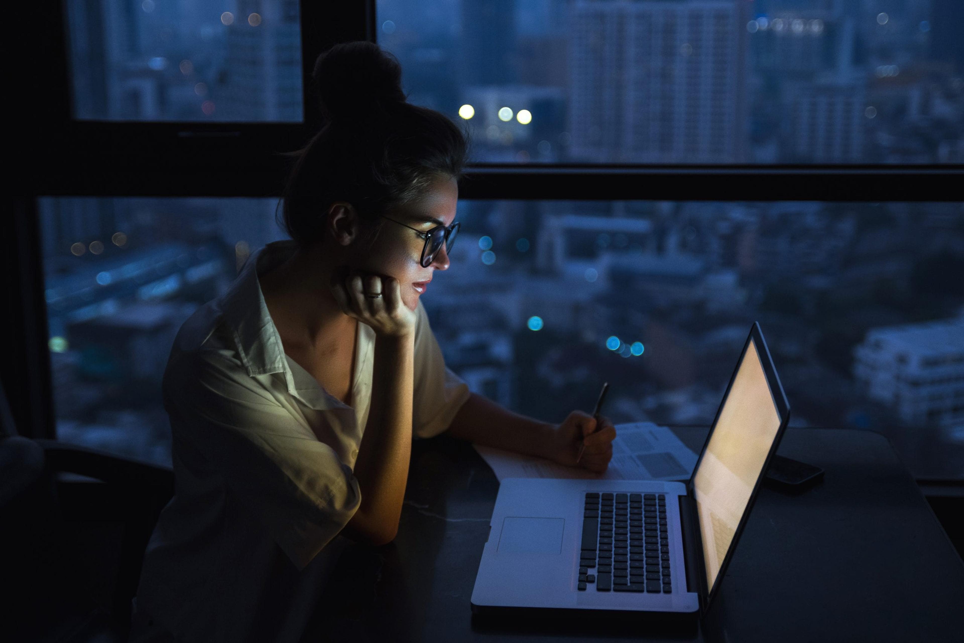 Woman staring at laptop