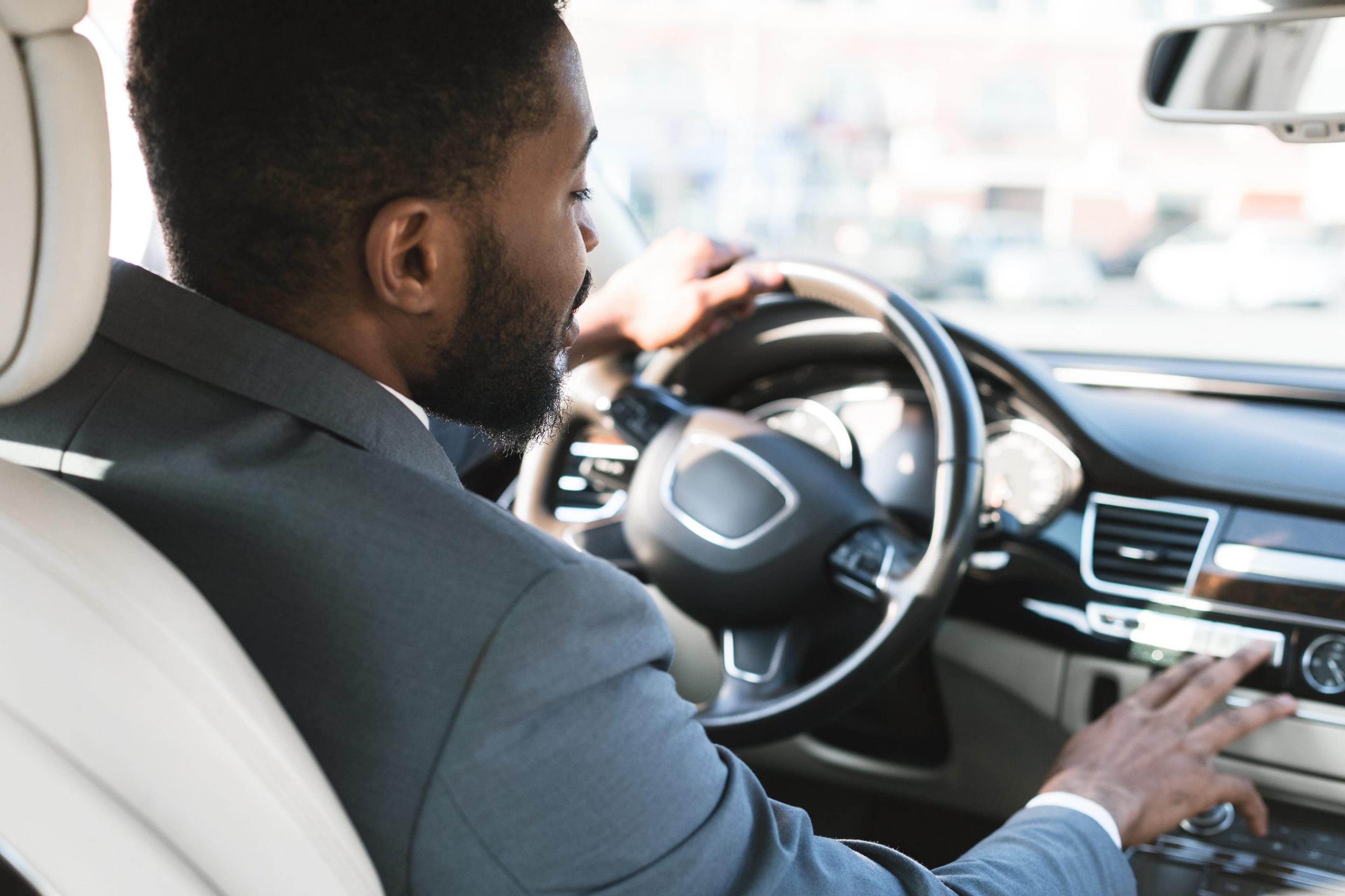 Man behind the wheel of a car