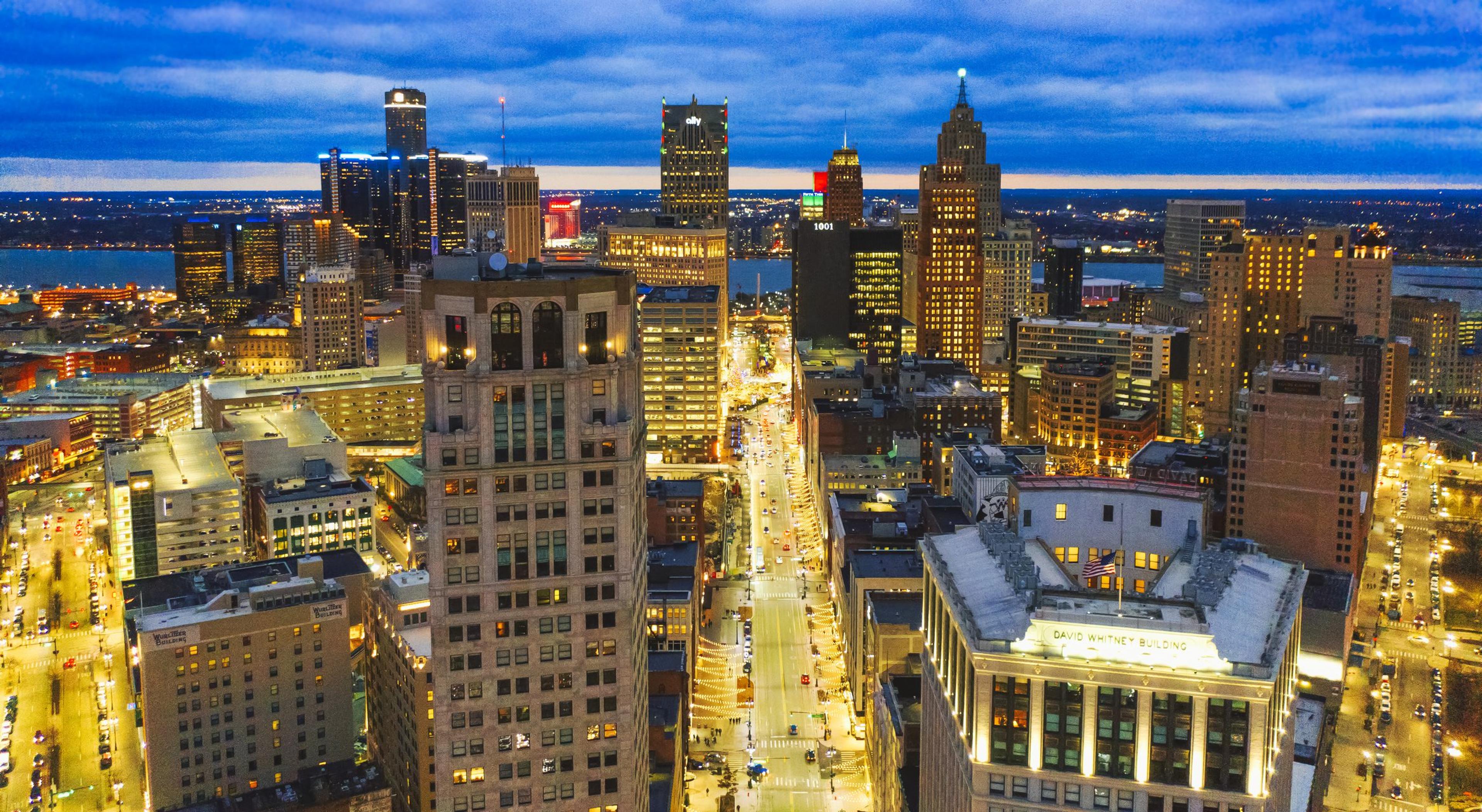 Aerial Skyline of Detroit downtown with Michigan at night