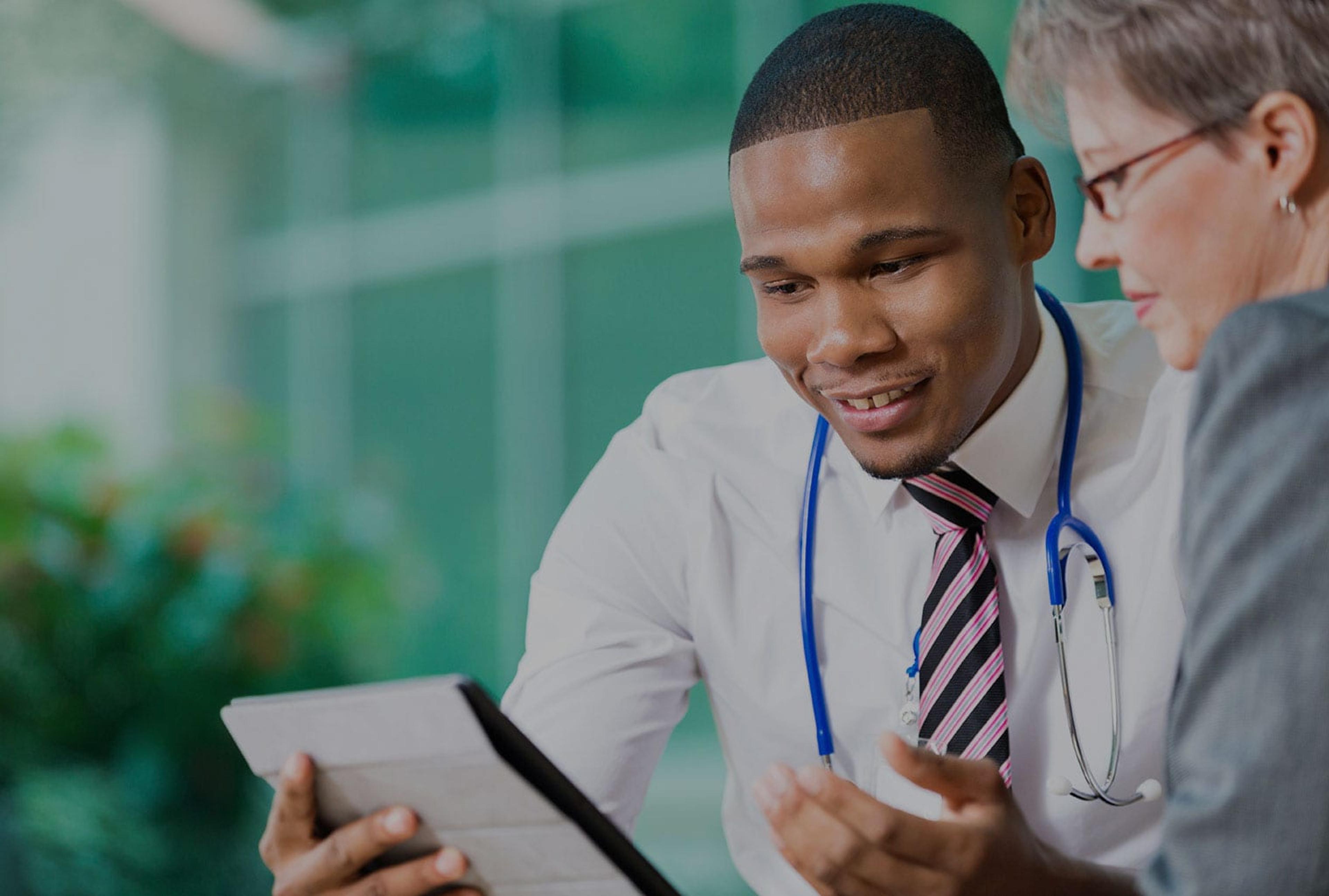 African-American doctor with a female patient