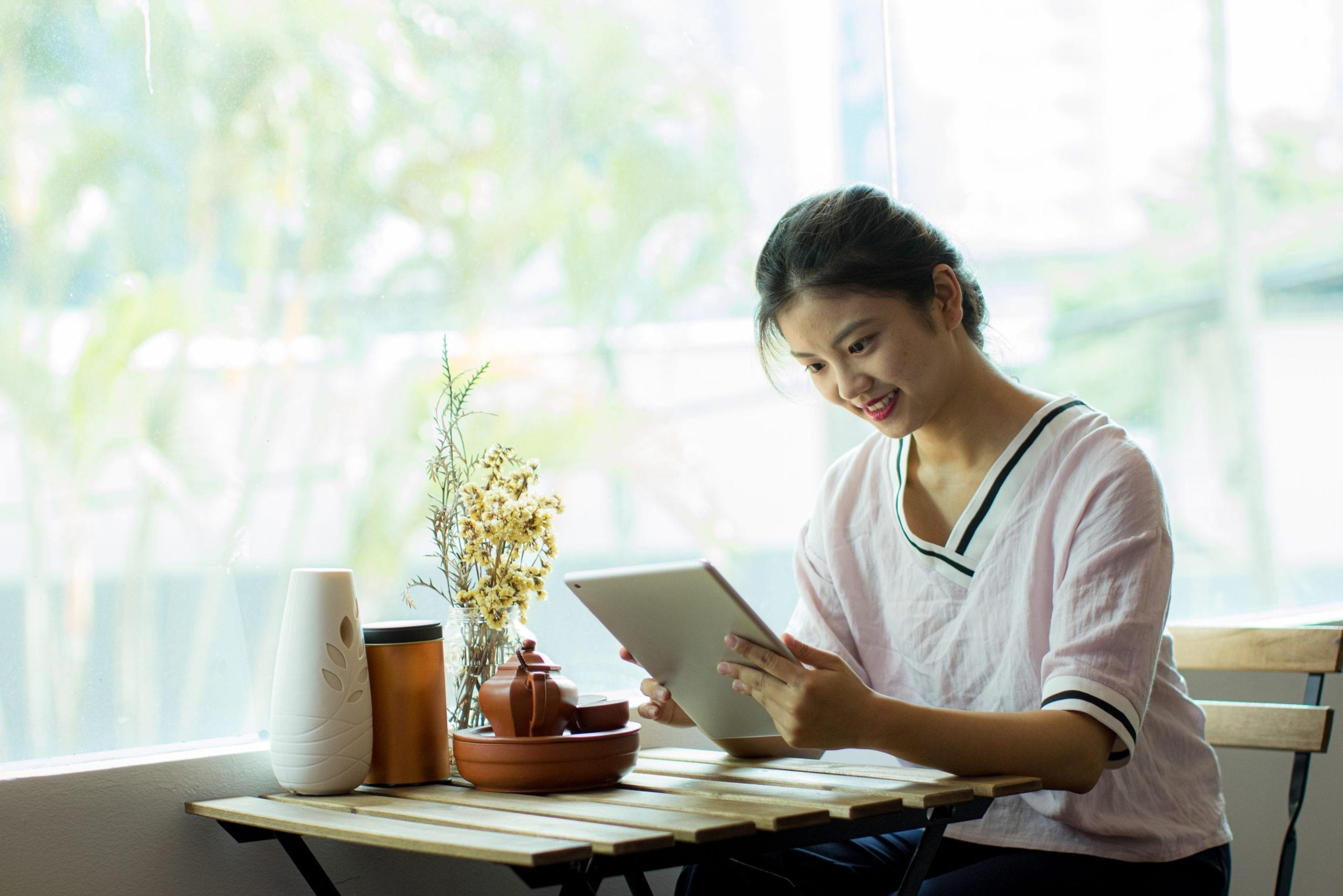 Woman looking at her tablet