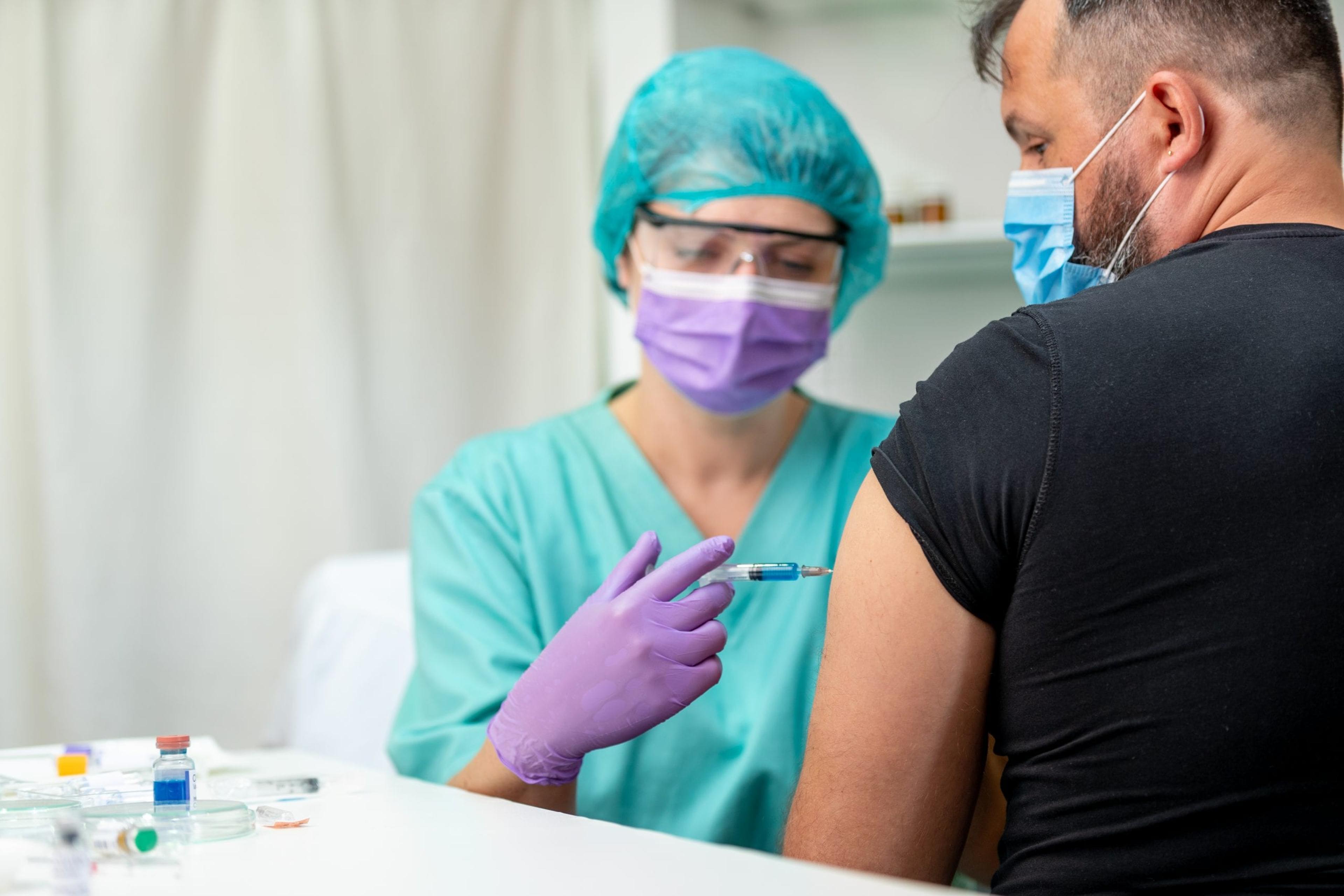 Health care worker getting a shot