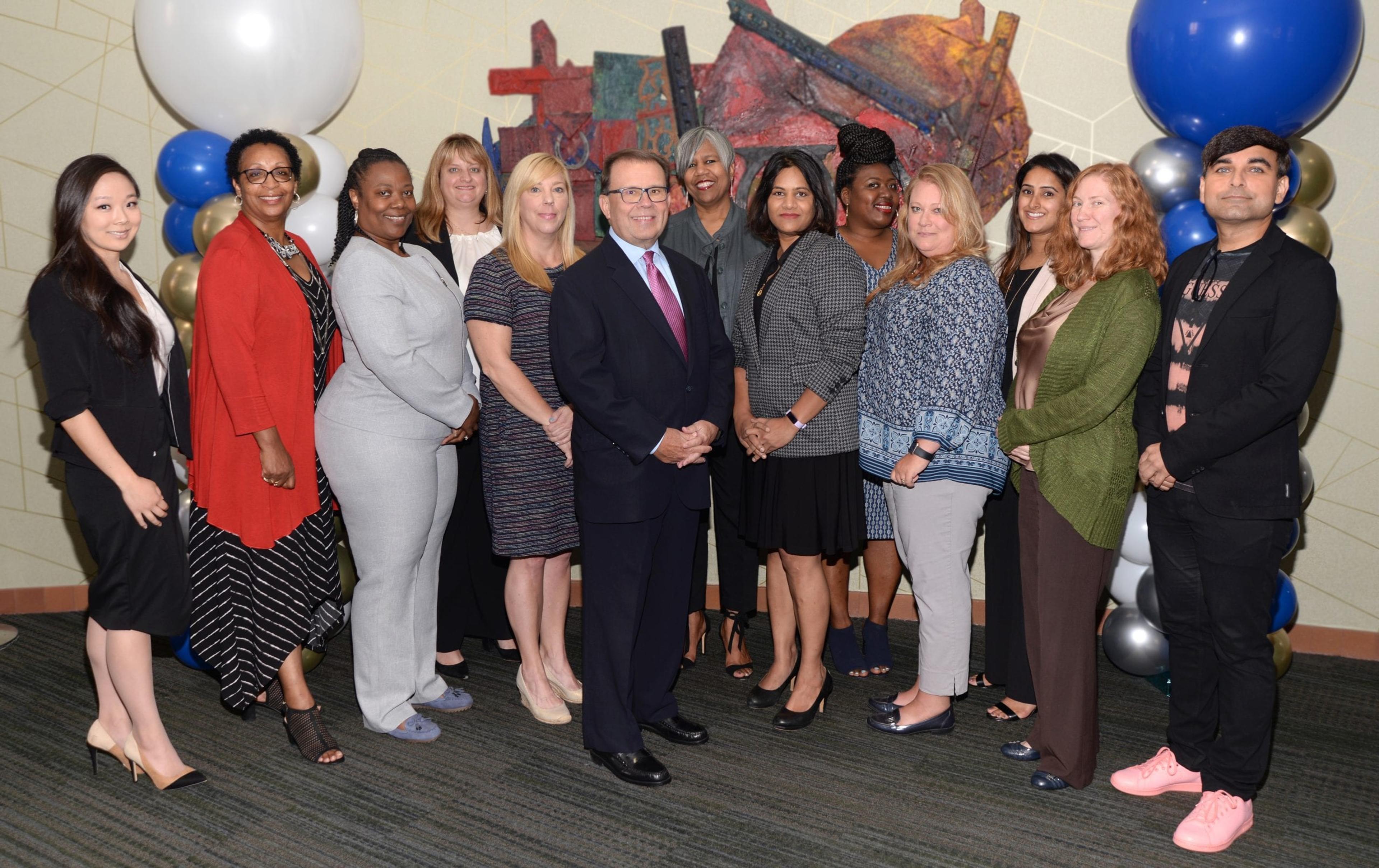 Daniel J. Loepp with employees at an August Celebrate Diversity event.