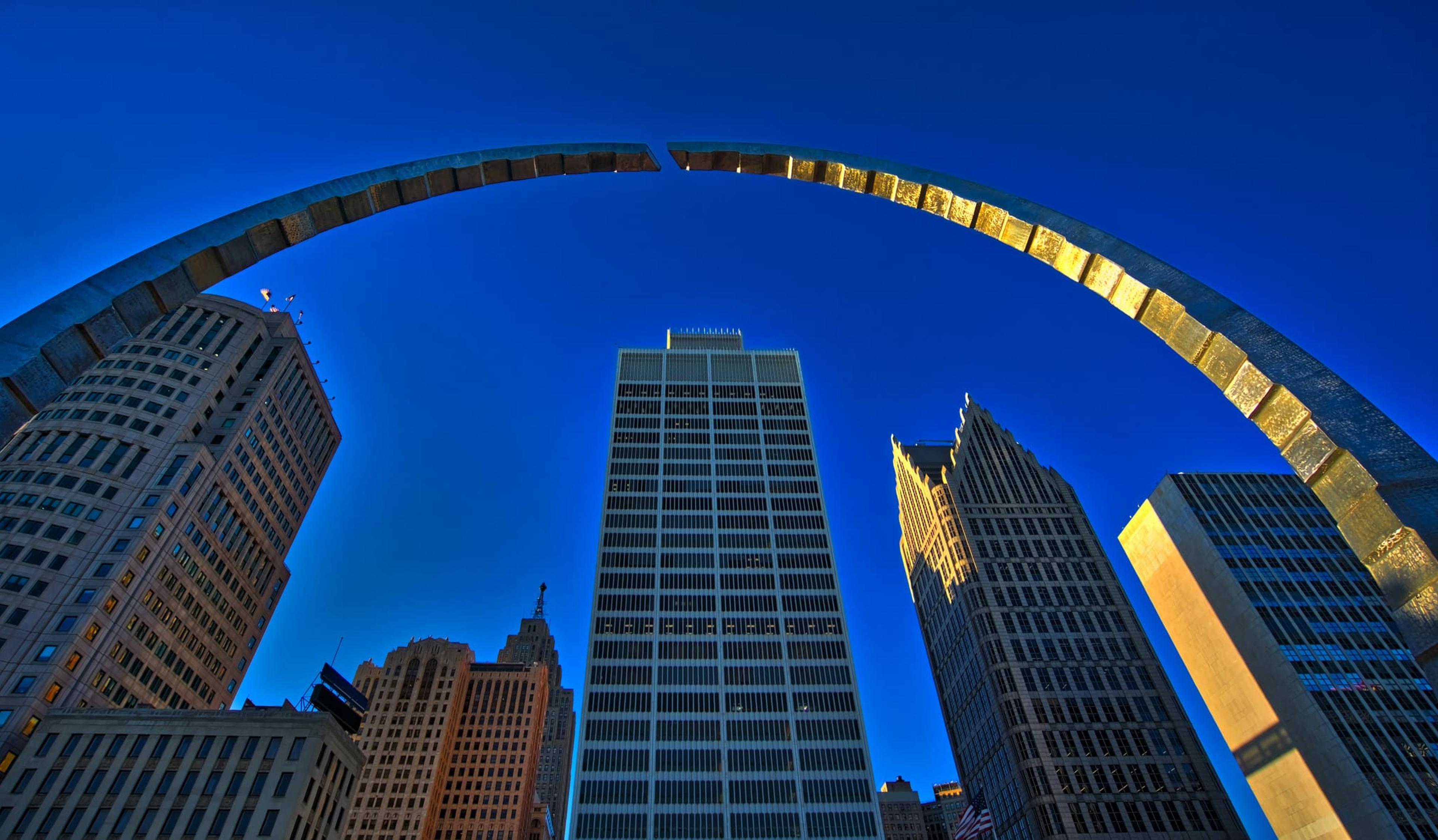 Arch and buildings against a blue sky