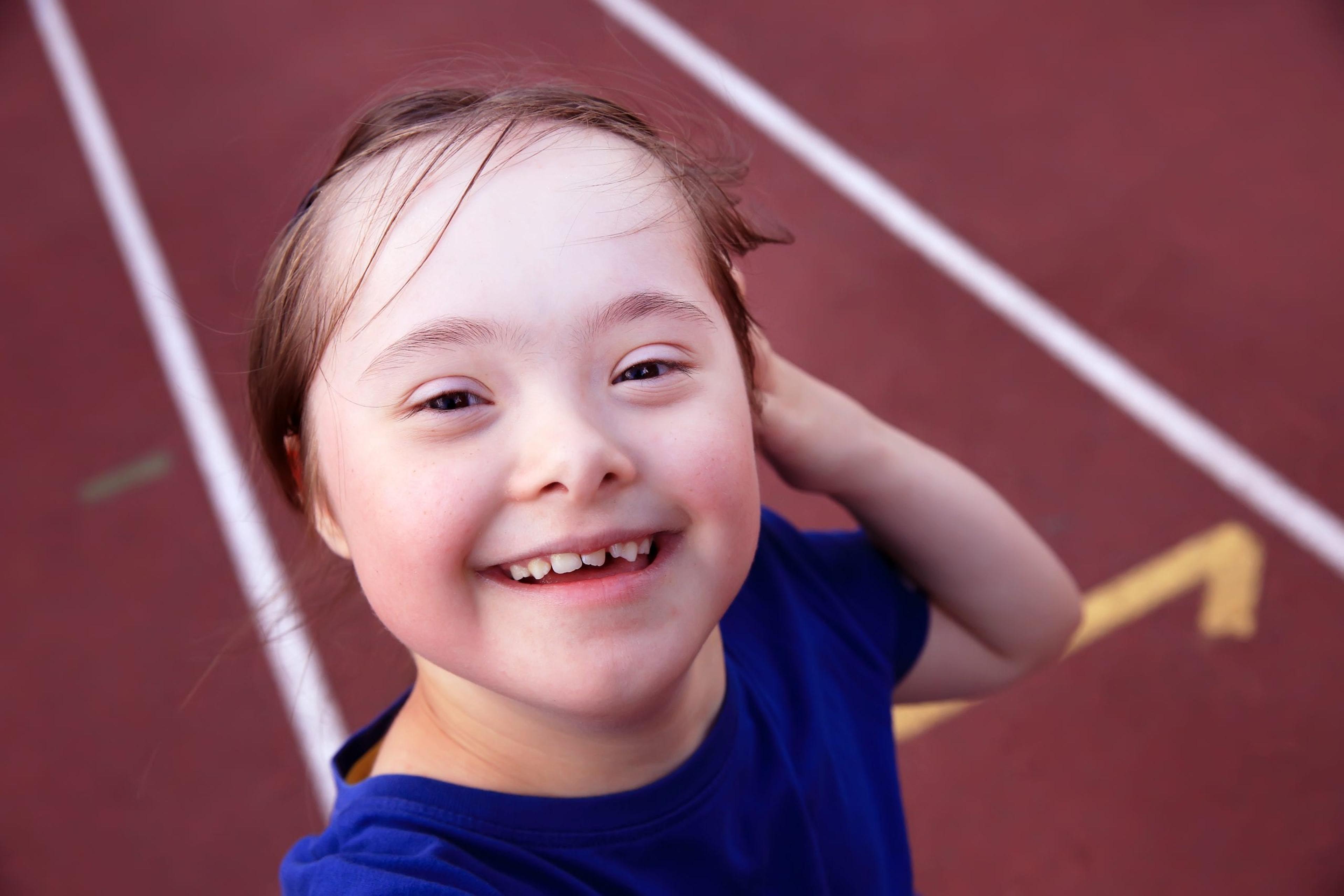 Little girl with Down's syndrome on the track.