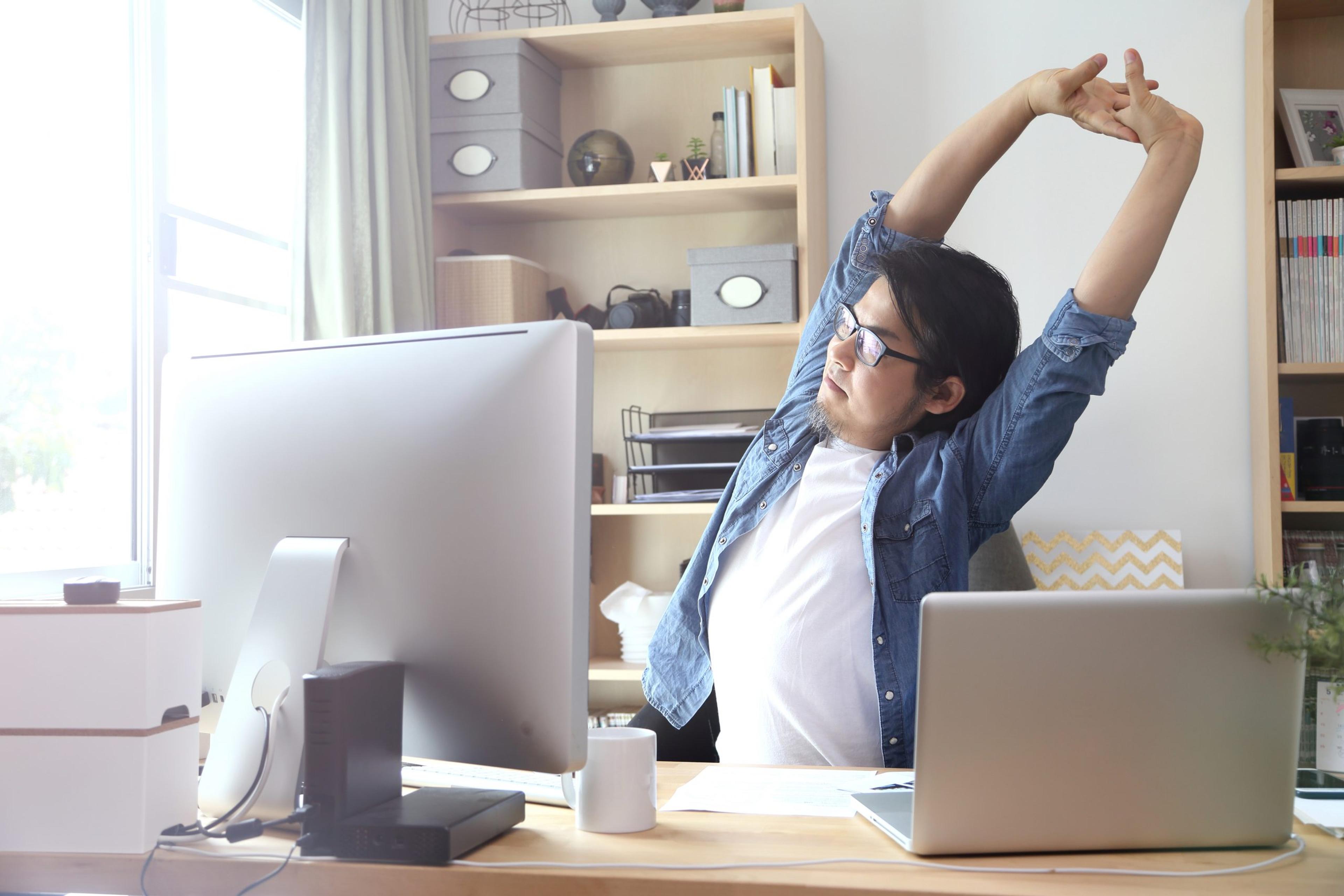 The Asian man working at home.