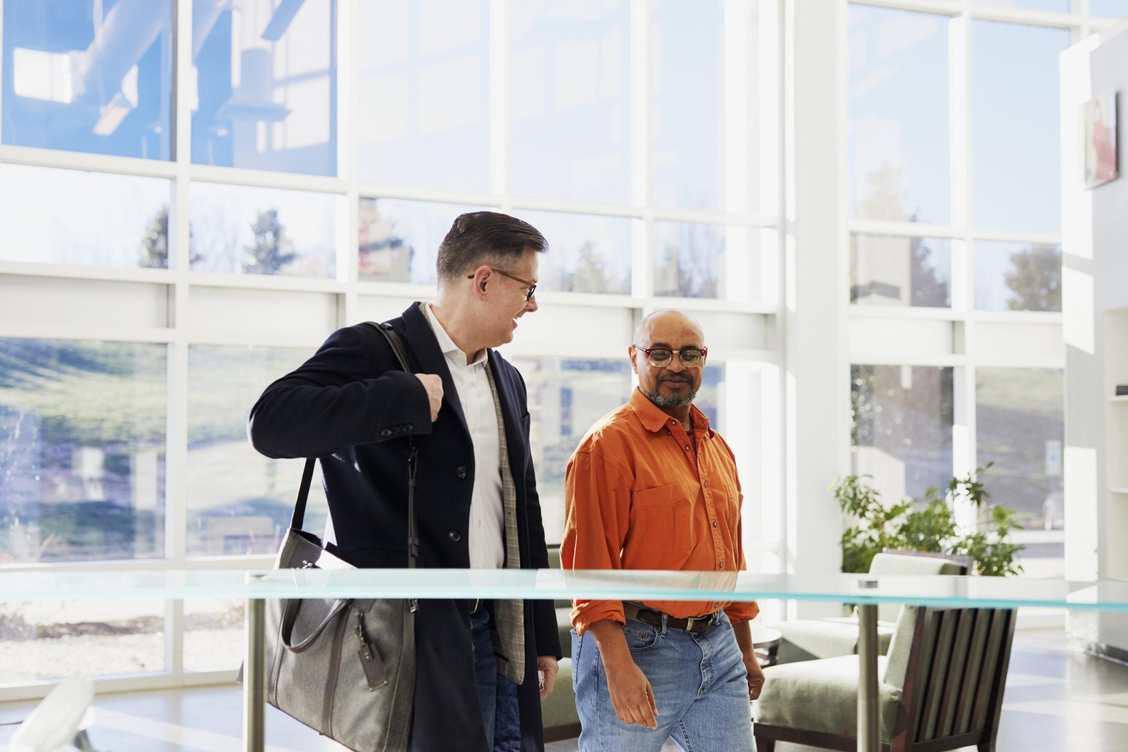 two employees walking inside