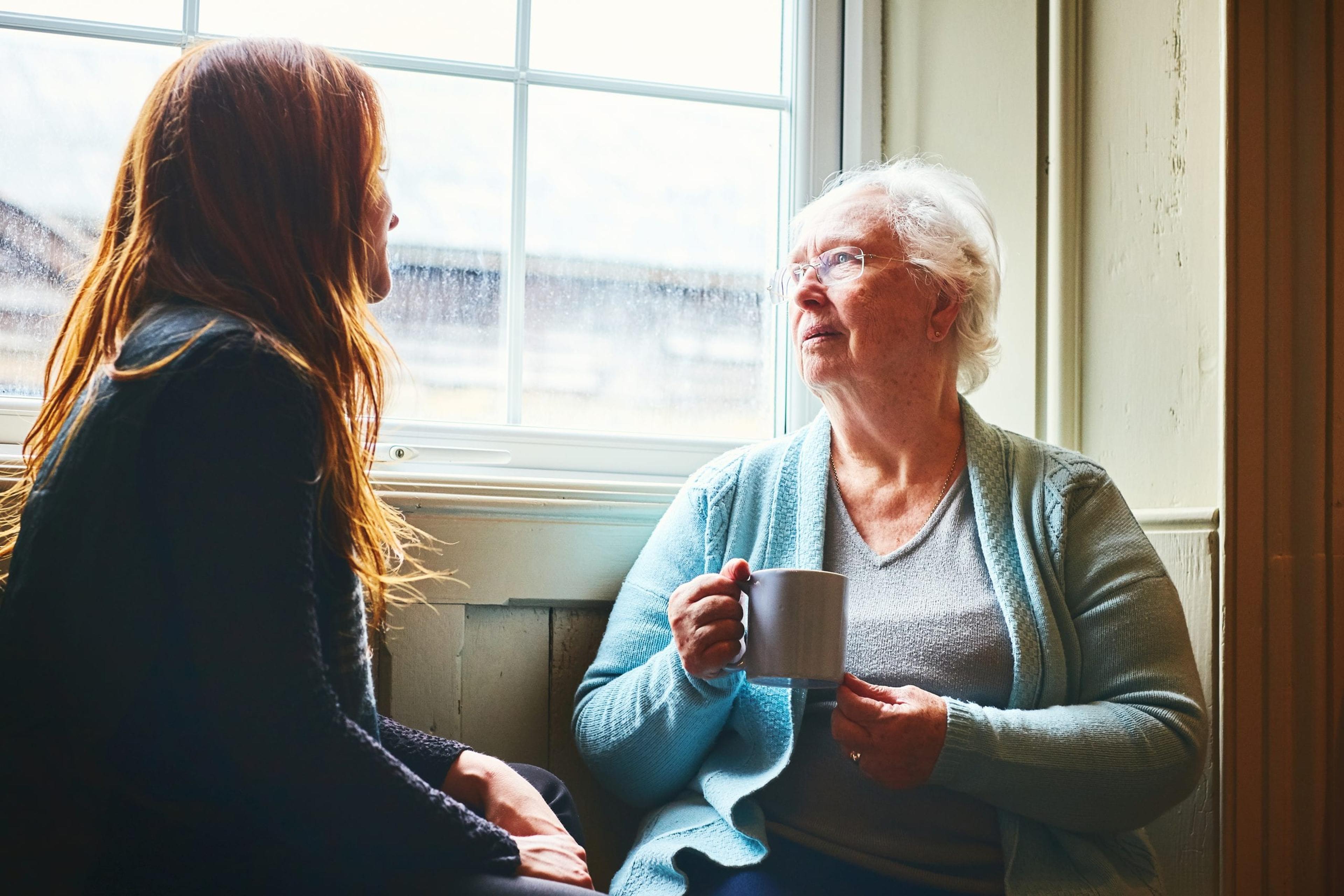 Older woman talking to a younger woman