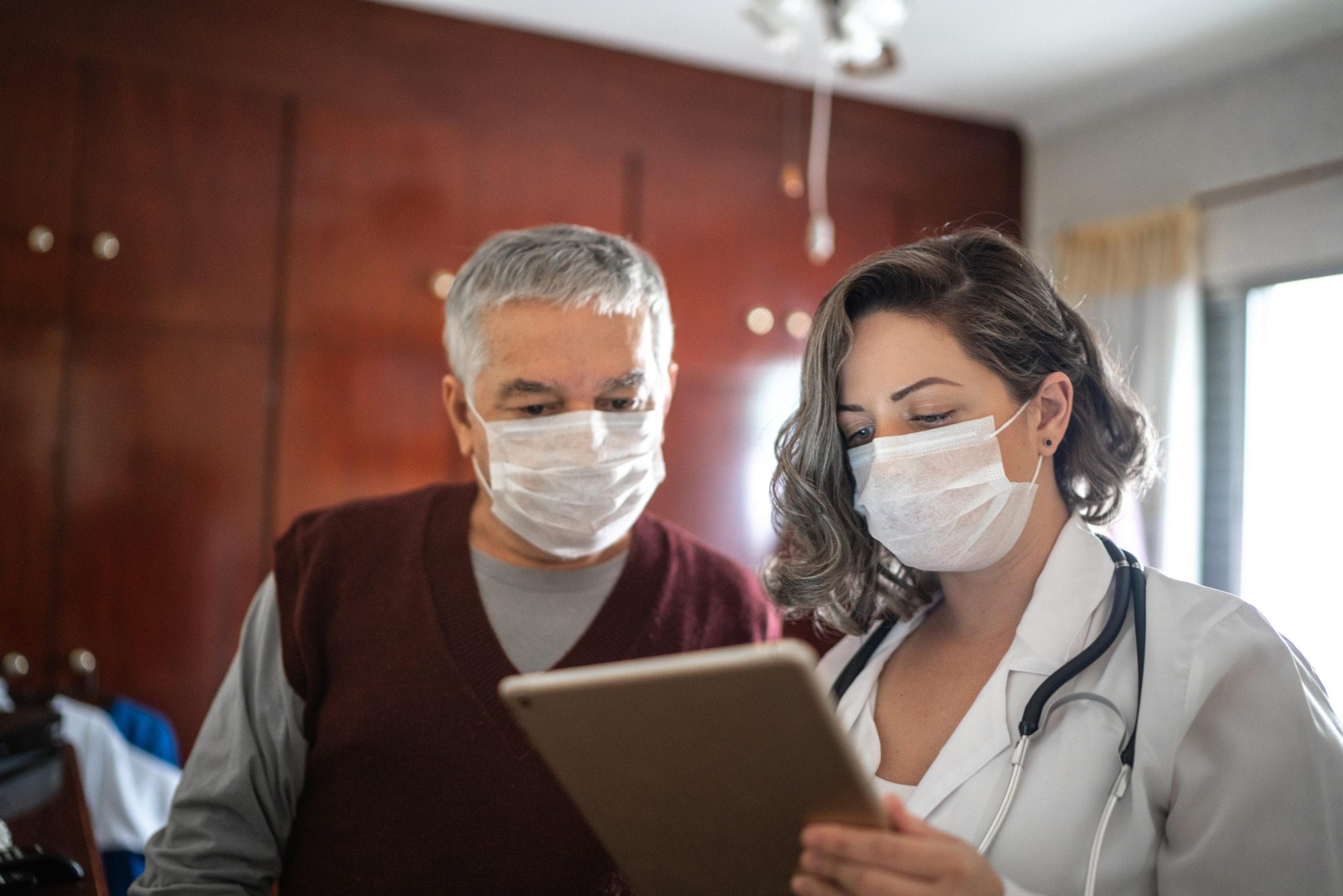 Older patient talking to his doctor