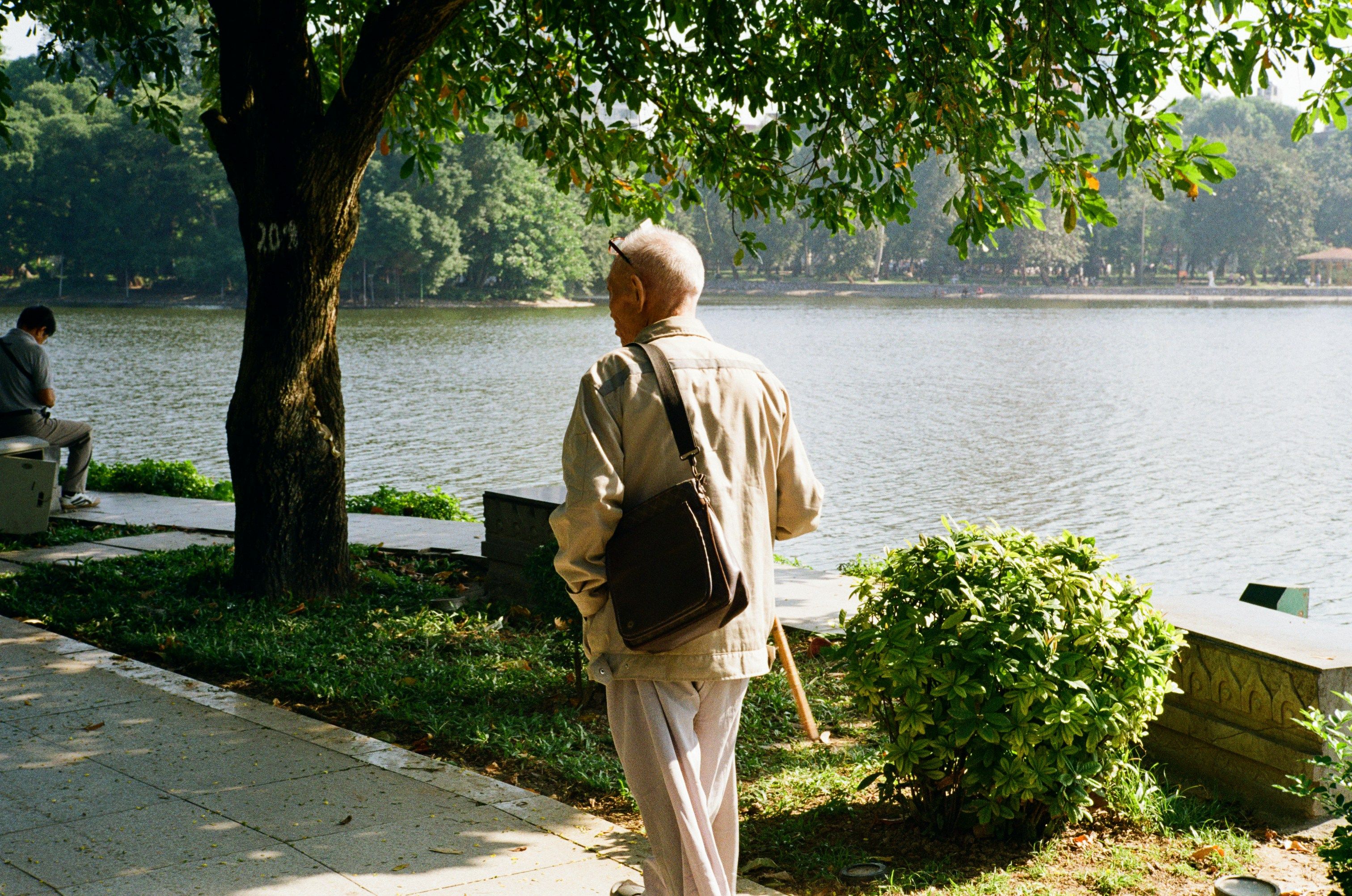 Senior walking by river