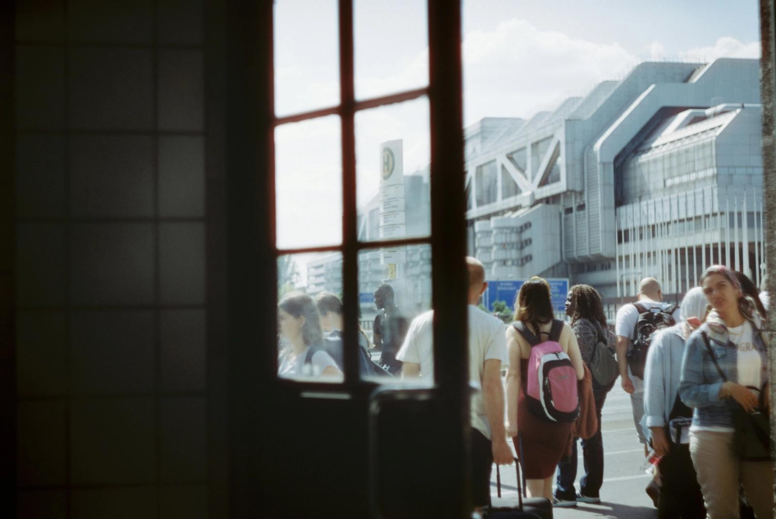 people walking from indoors