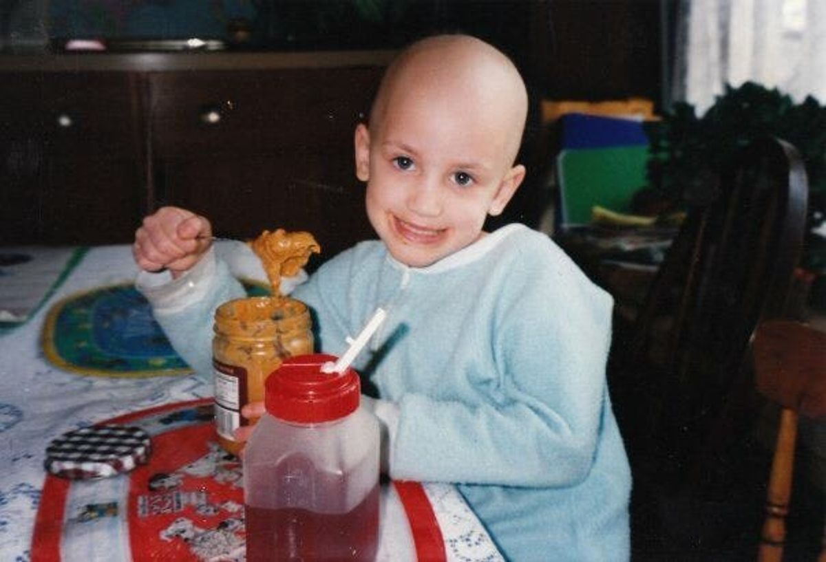 child eating peanut butter 