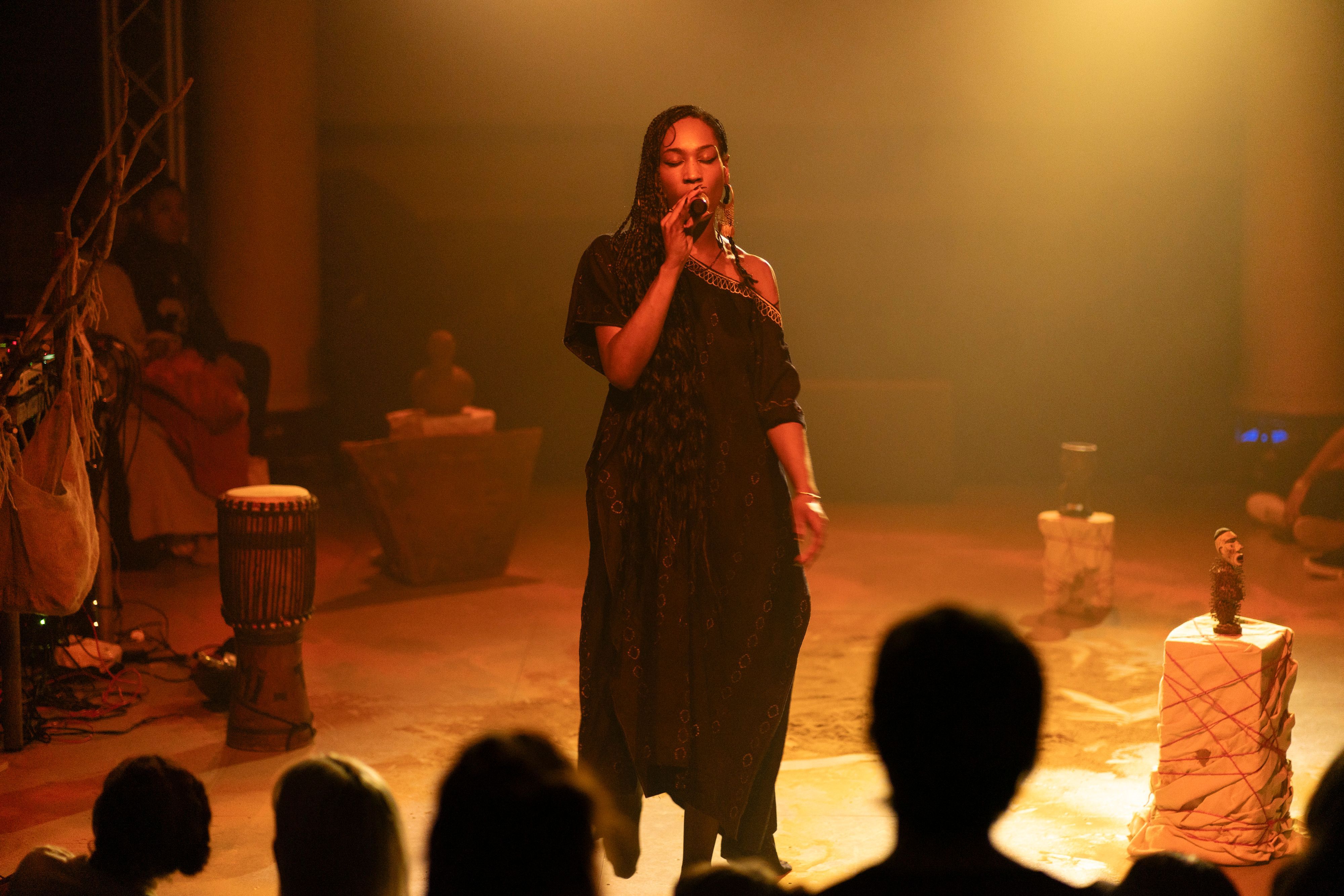 Vocalist performing to a standing audience, Assembly 2024, Somerset House Studios