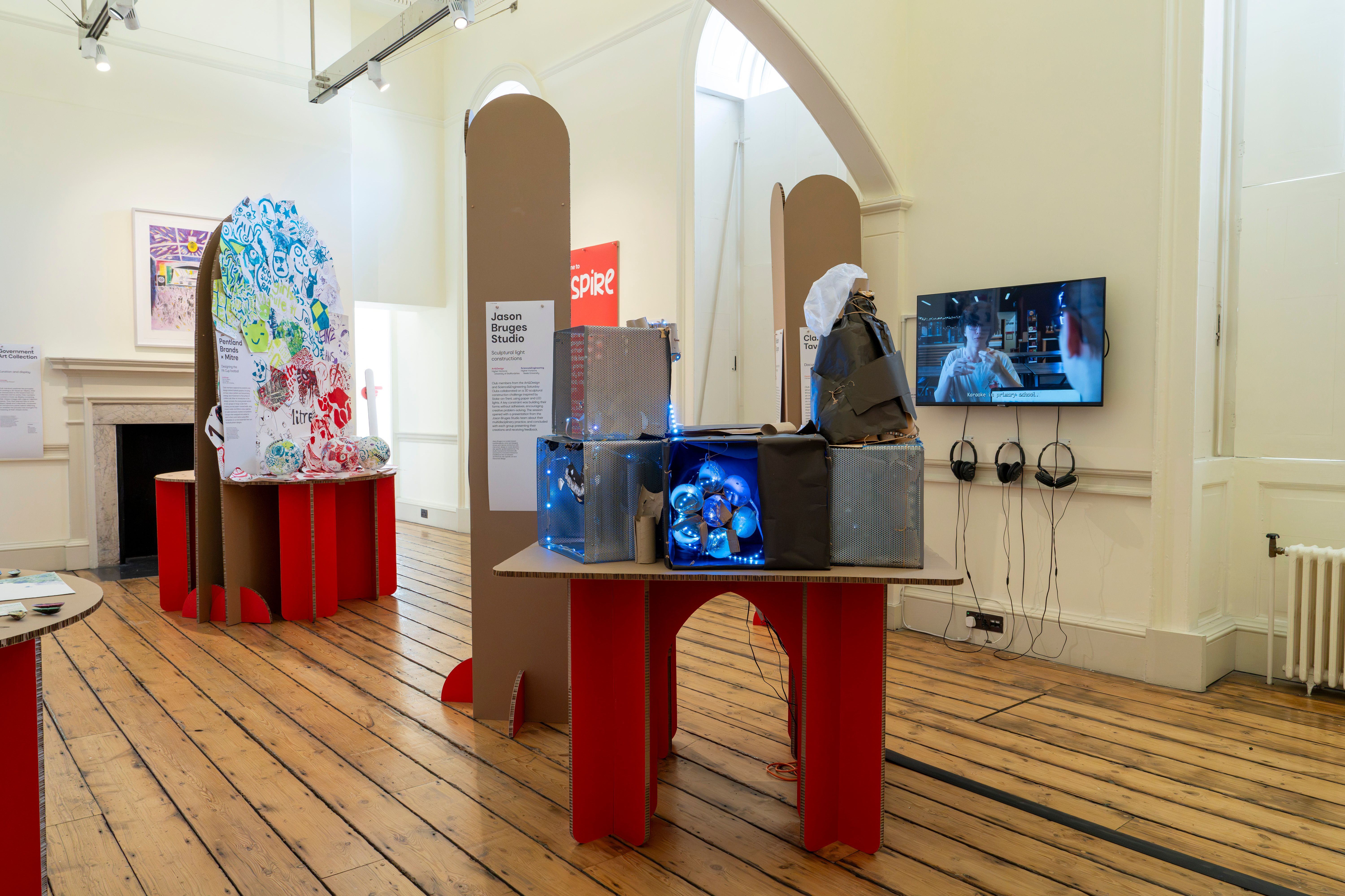 Wall-mounted screen and headphone listening point, National Saturday Club Summer Show 2026
