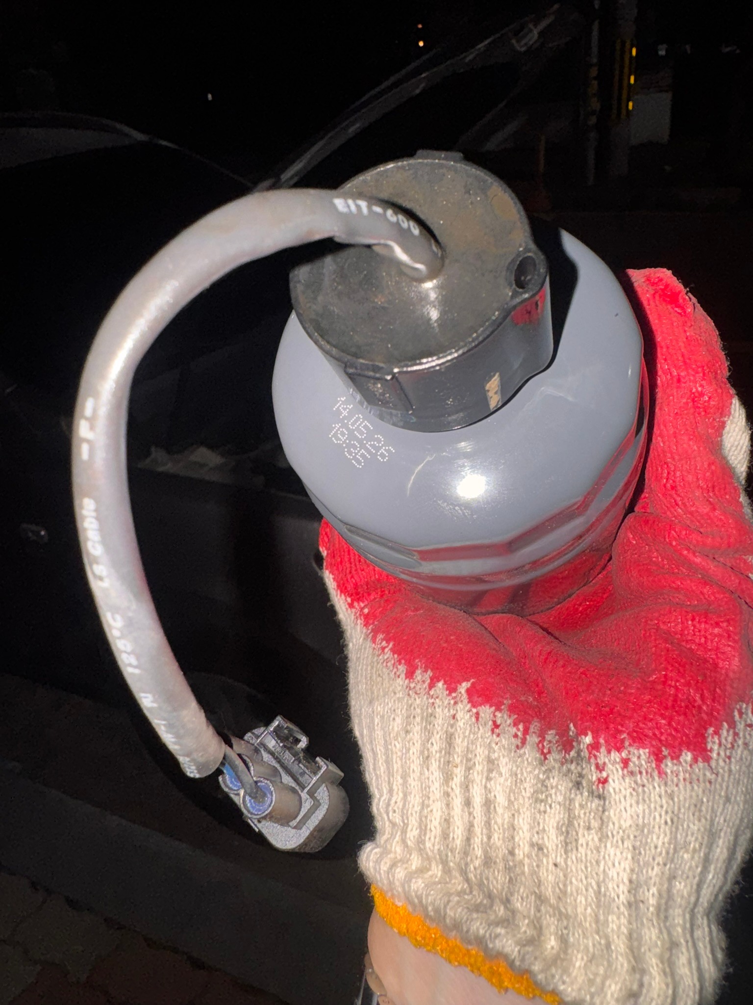New fuel filter cartridge with the water-in-fuel sensor and cable attached