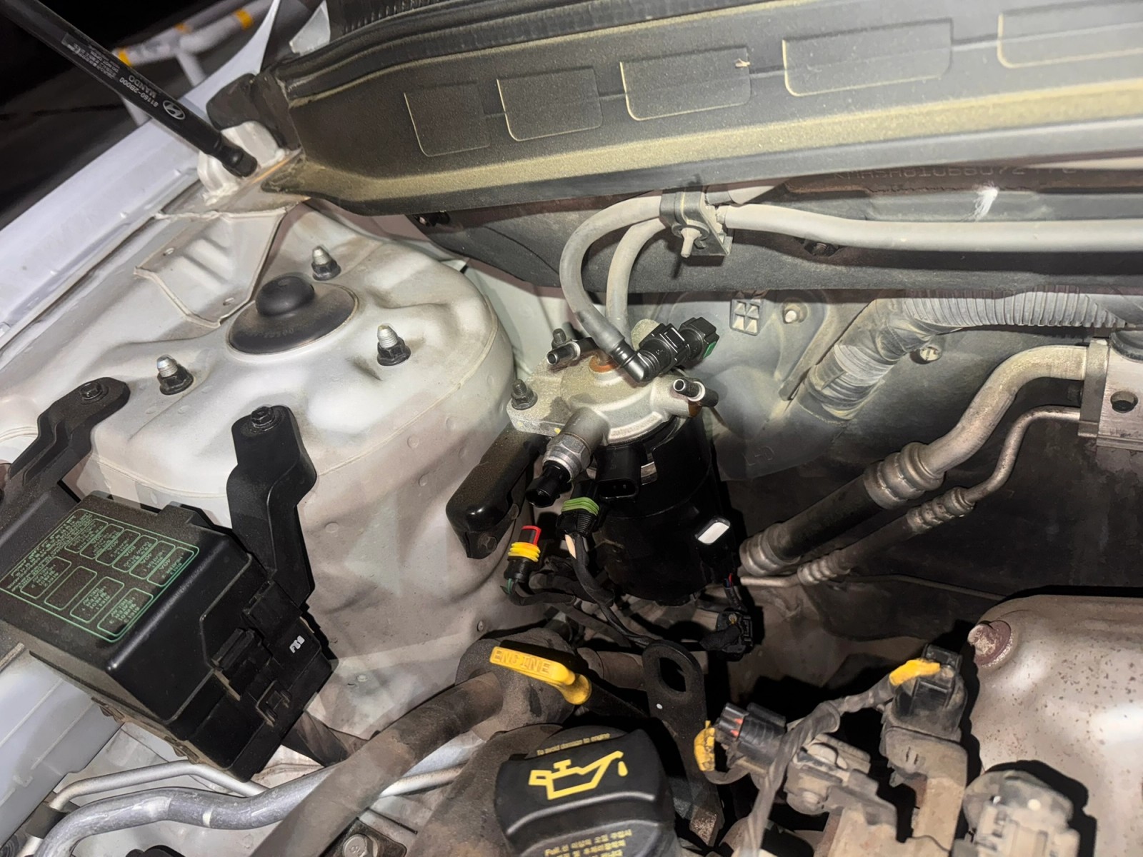 Fuel filter with the electrical connectors and fuel hoses disconnected